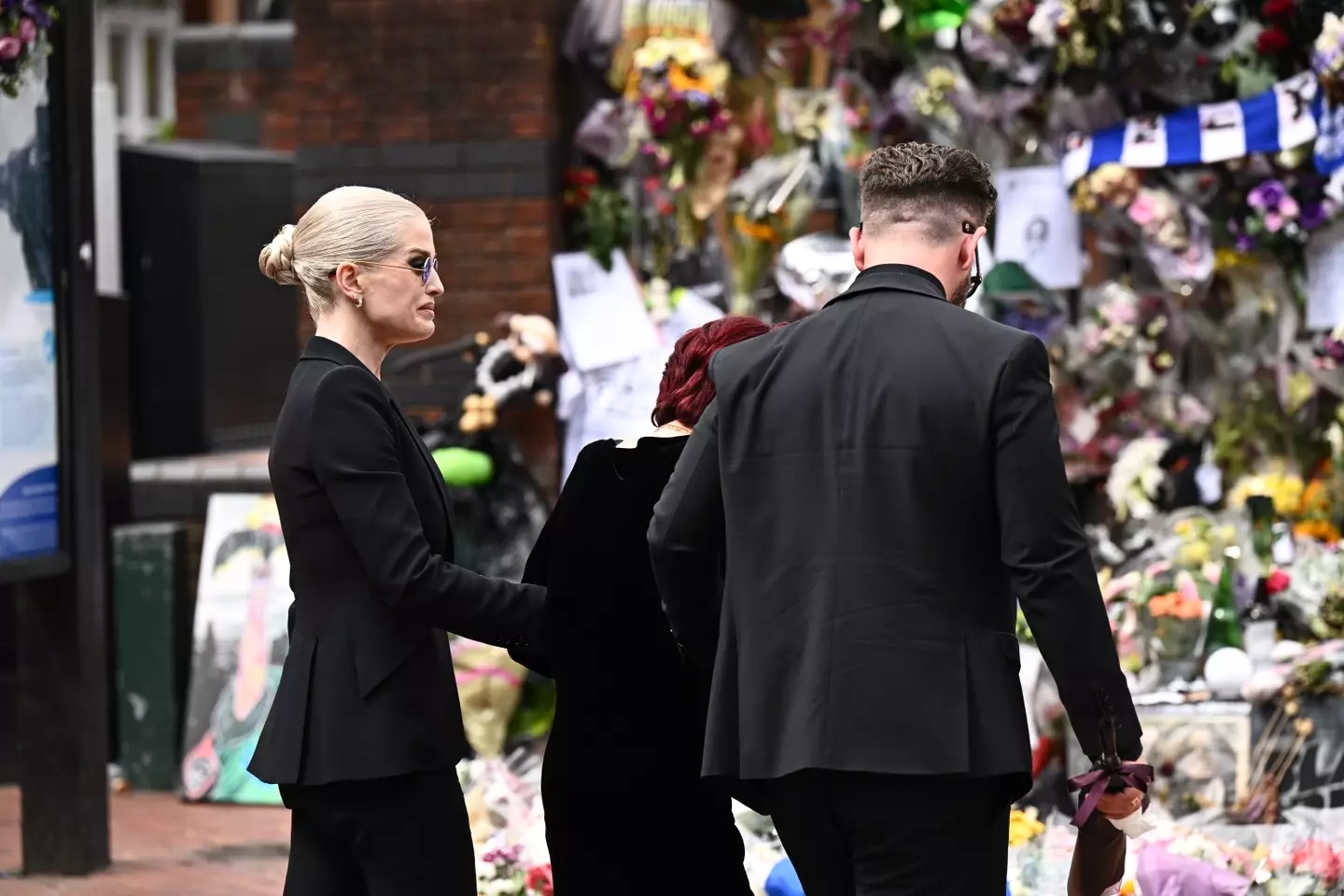 The streets of Birmingham were packed with Ozzy's fans who have left flowers and notes of love for the late singer (Leon Neal/Getty Images)