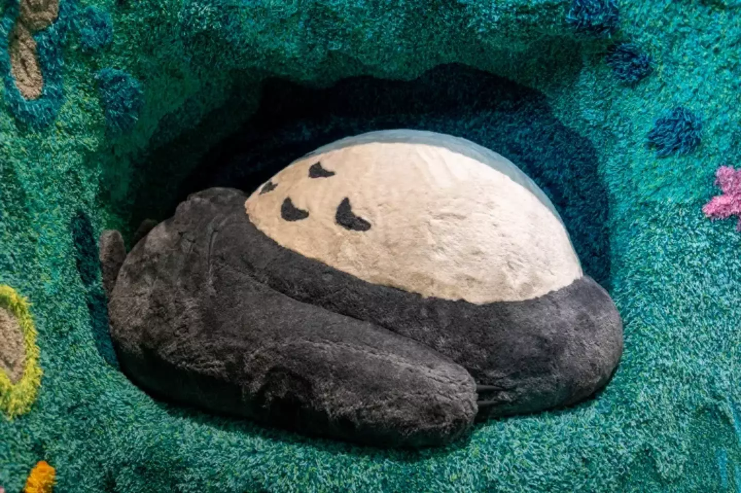 A play area in the theme park features a sleeping Totoro.
