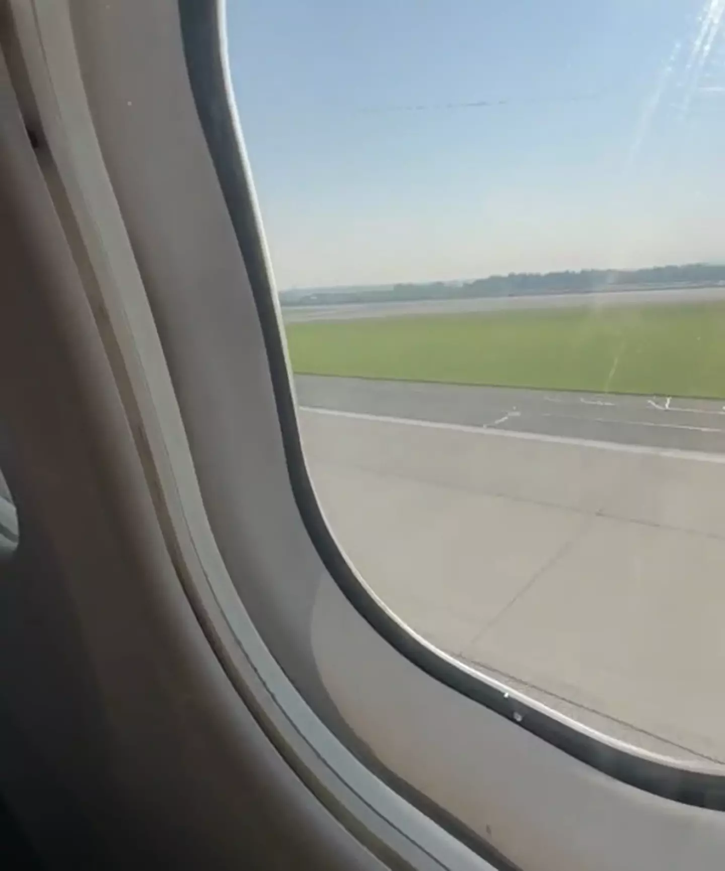 A passenger on board the Delta flight that came down safely with no front landing gear filmed the experience as they touched down on tarmac.