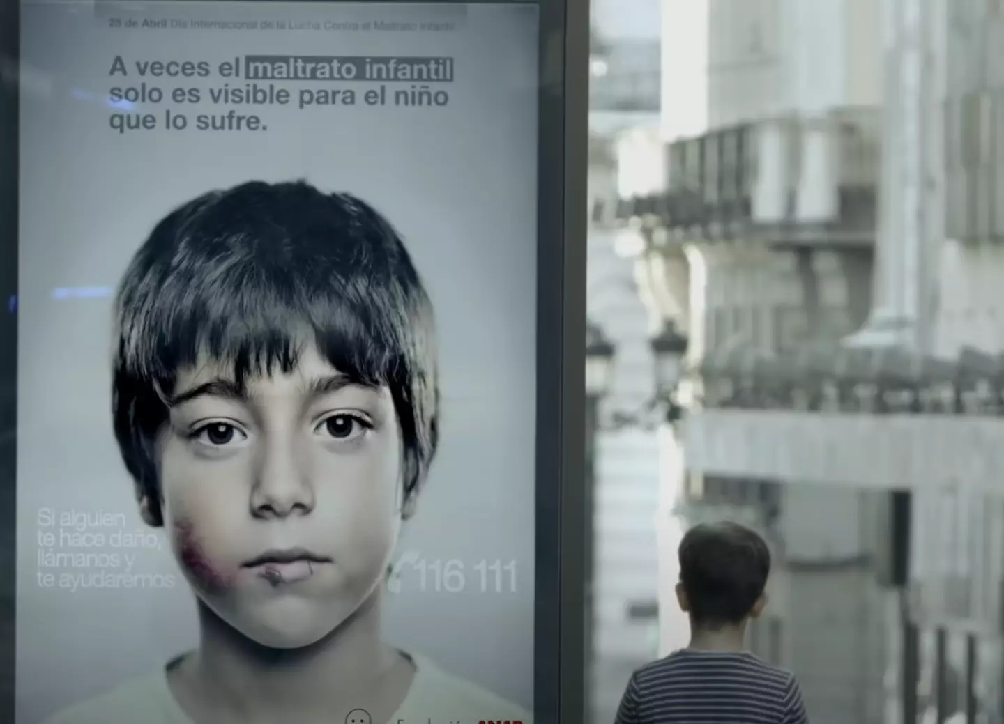 The hidden message reveals a number that children can call if they need help.