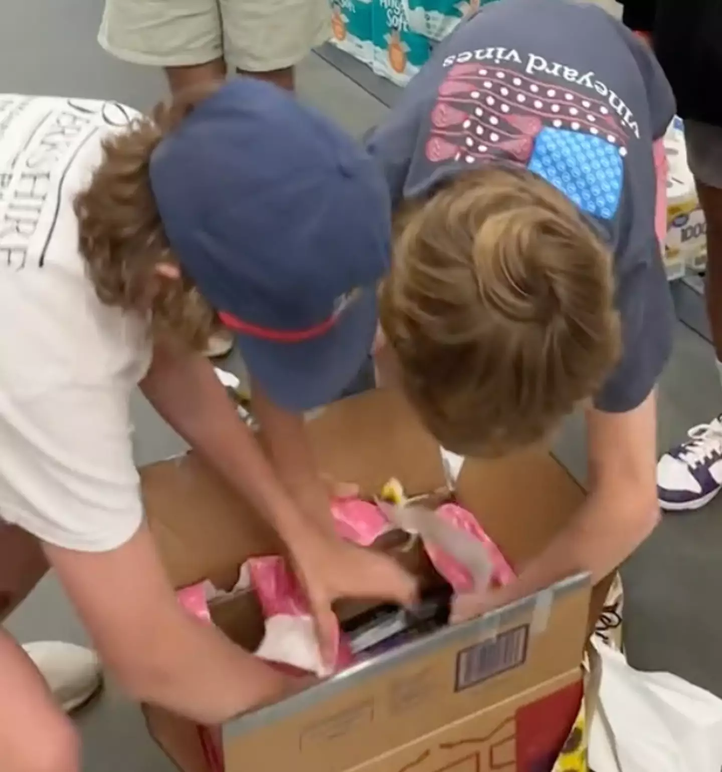 The kids were racing around trying to unwrap the boxes.