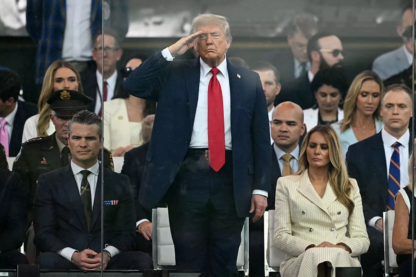 President Donald Trump pictured saluting to troops from the US Army during its 250th anniversary parade, which coincided with his birthday (MANDEL NGAN/AFP via Getty Images)