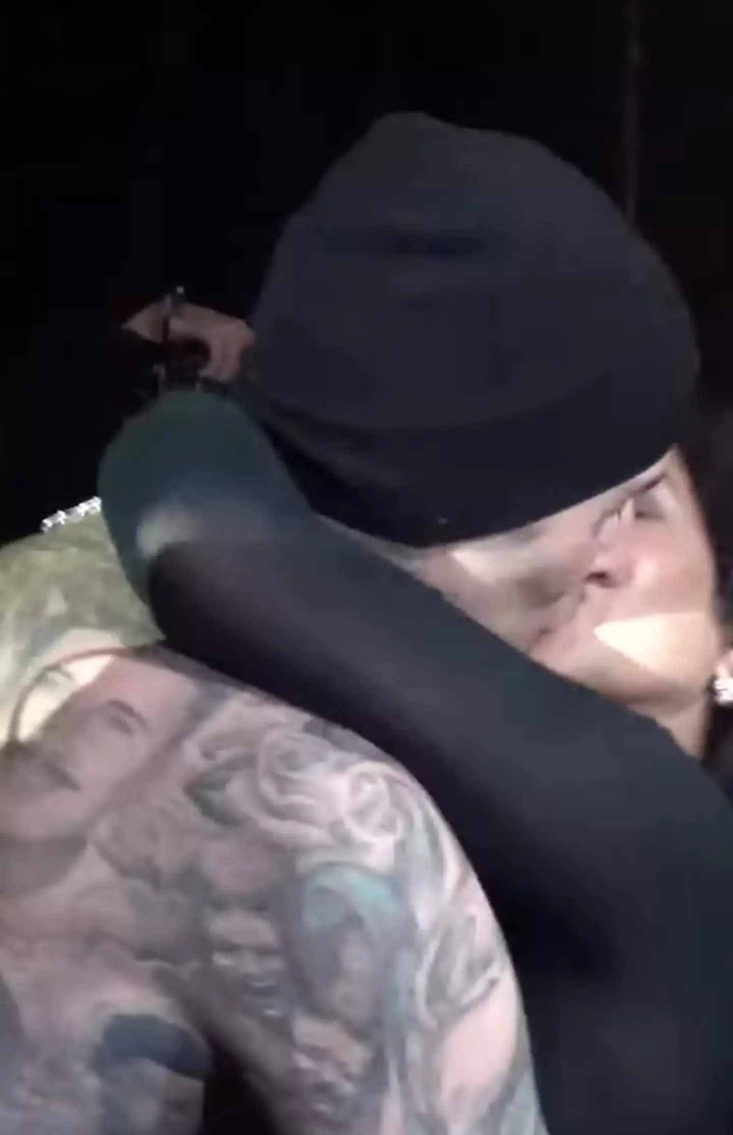 The pair shared an embrace after Travis climbed down off stage.