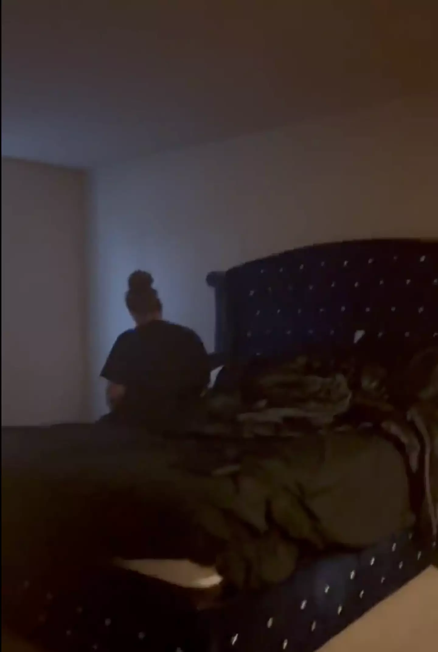 There was a woman in the bed with him.