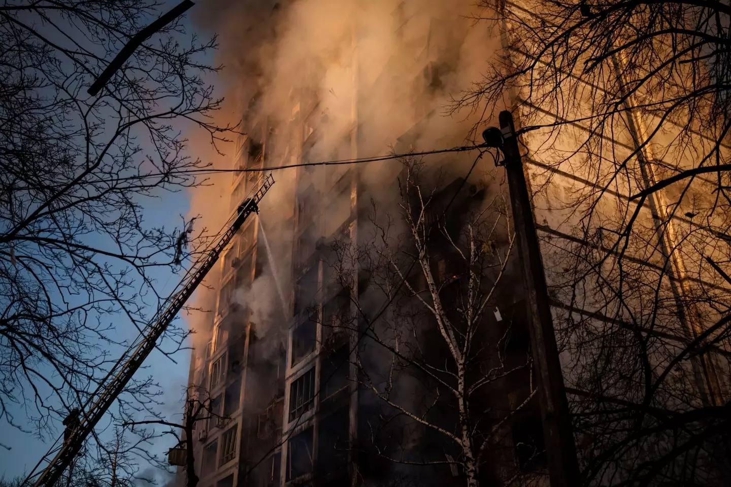 Residential building in Kyiv on fire. (Felipe Dana/AP/Shutterstock)
