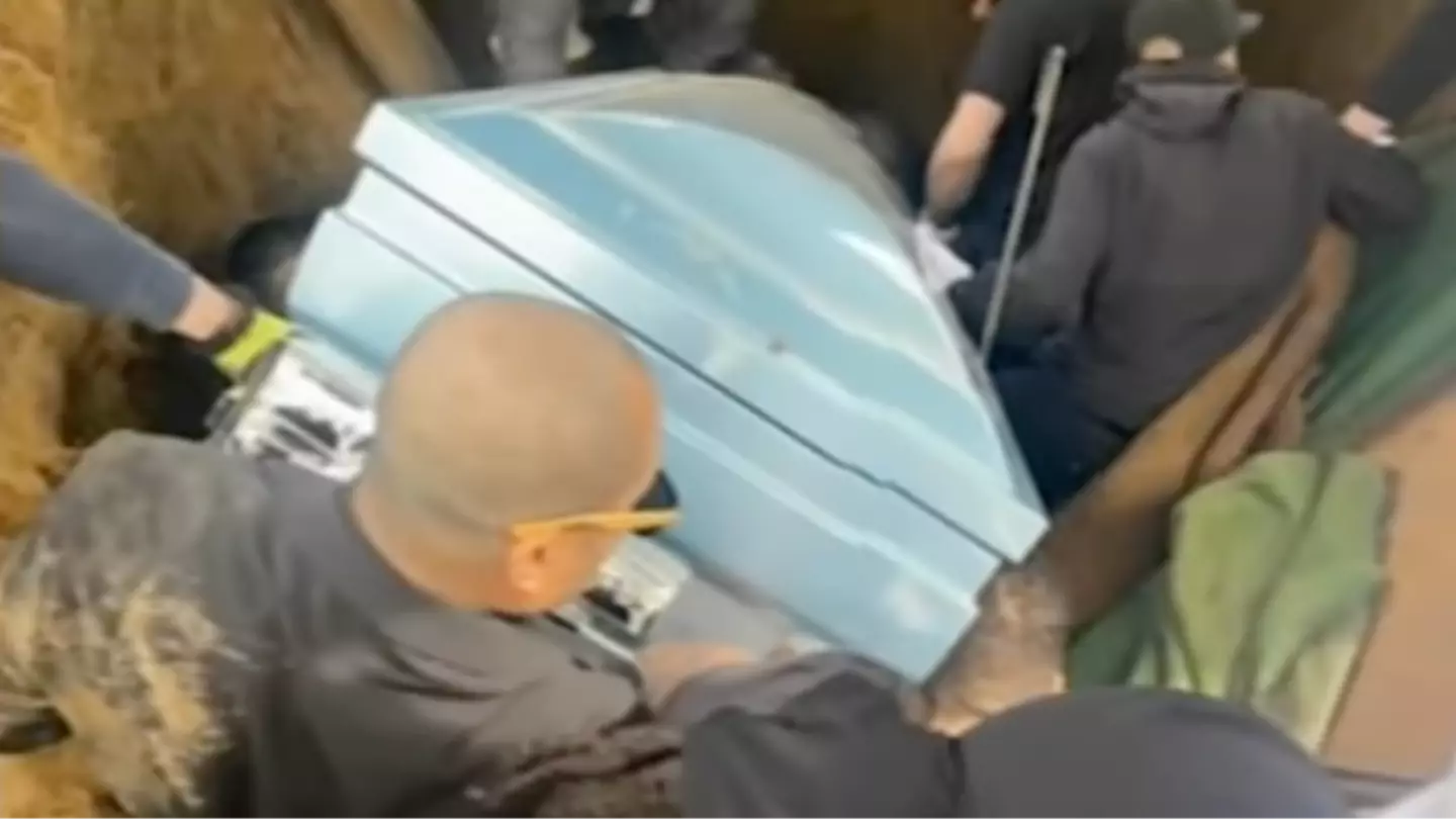 Horrific footage shows moment grieving pallbearers fall into burial hole as son of deceased man gets stuck under casket
