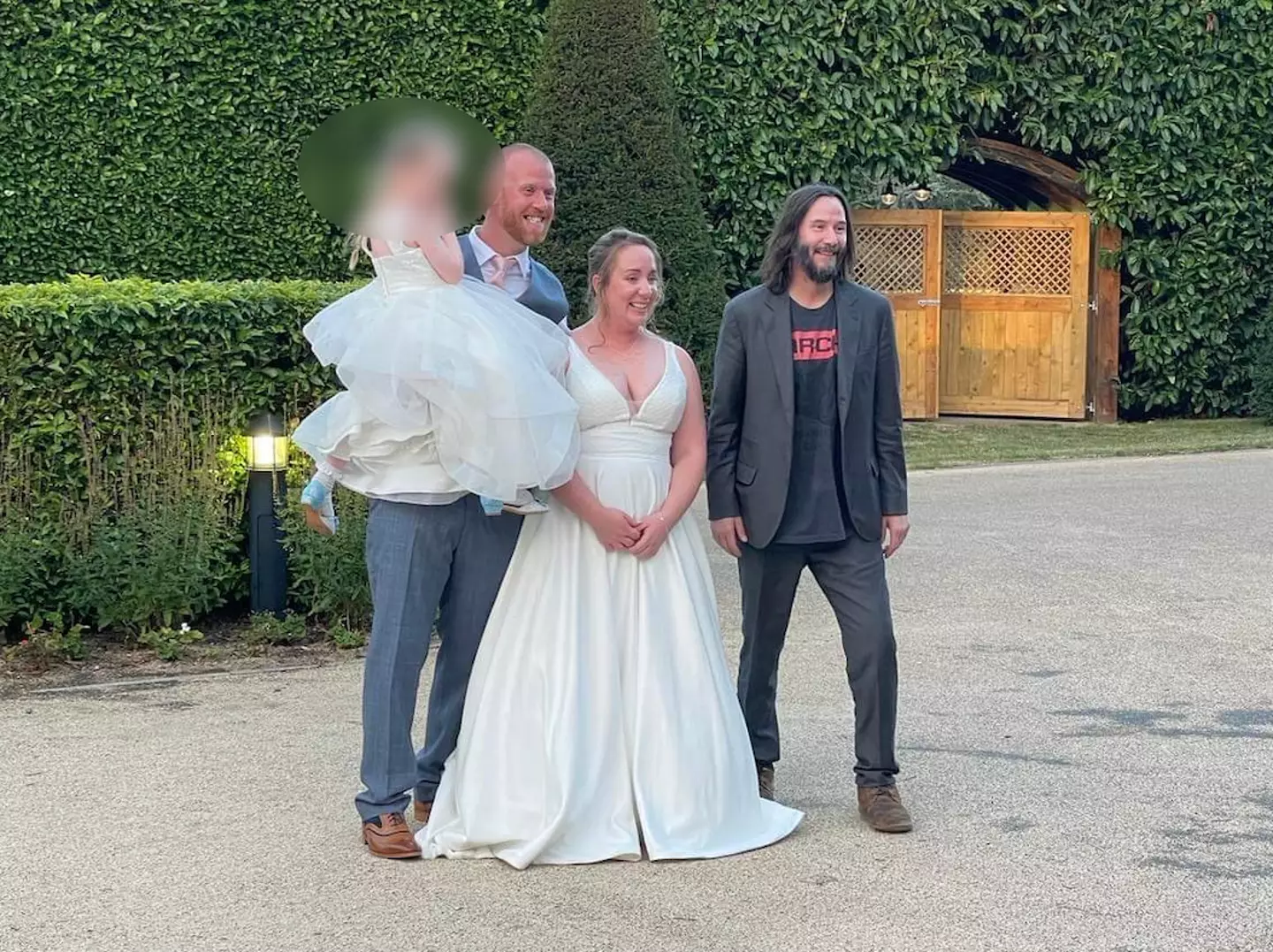 Keanu was happy to pose for some snaps with the newlyweds.