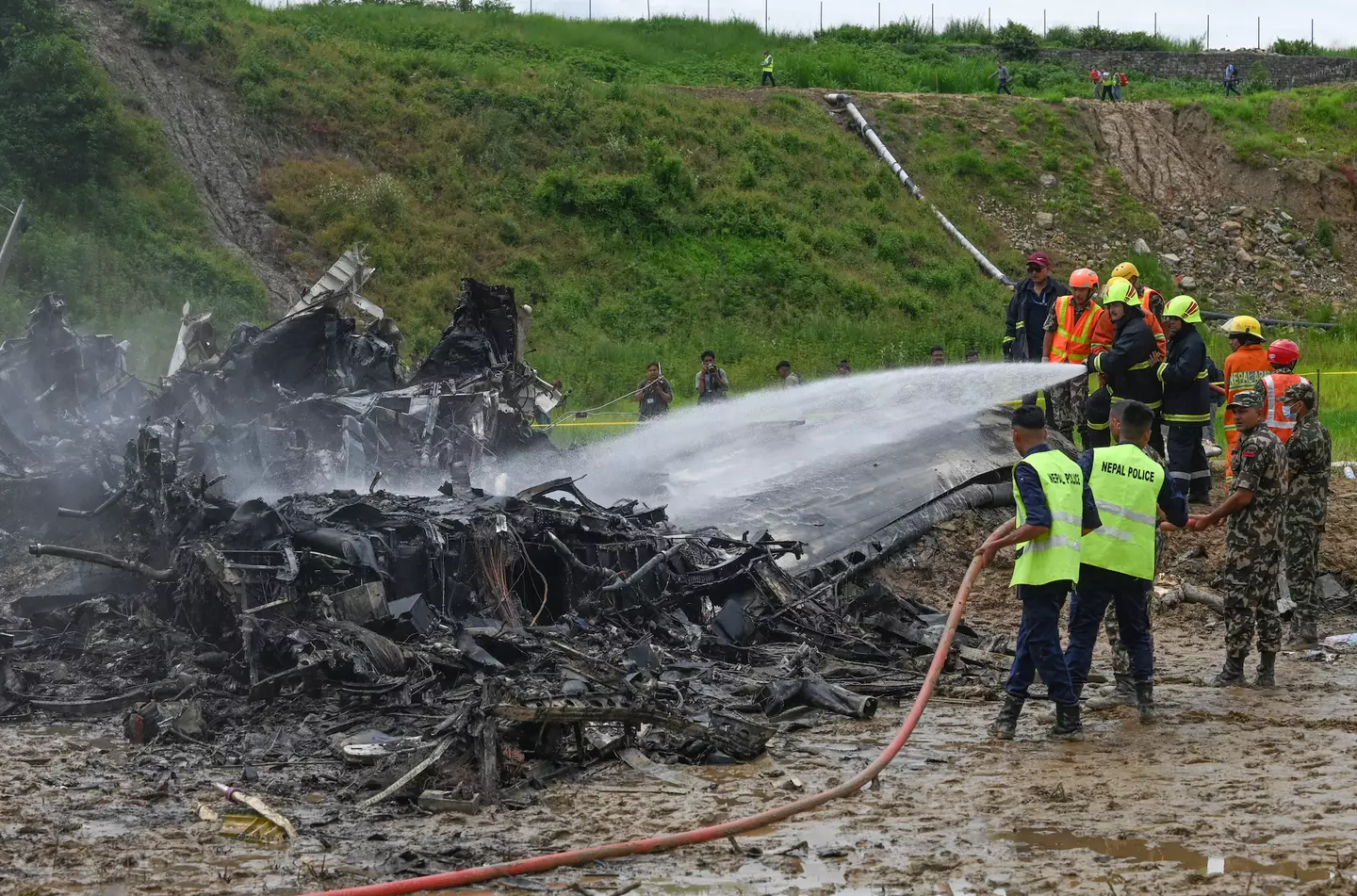 18 people died in the crash. (PRAKASH MATHEMA/AFP via Getty Images)