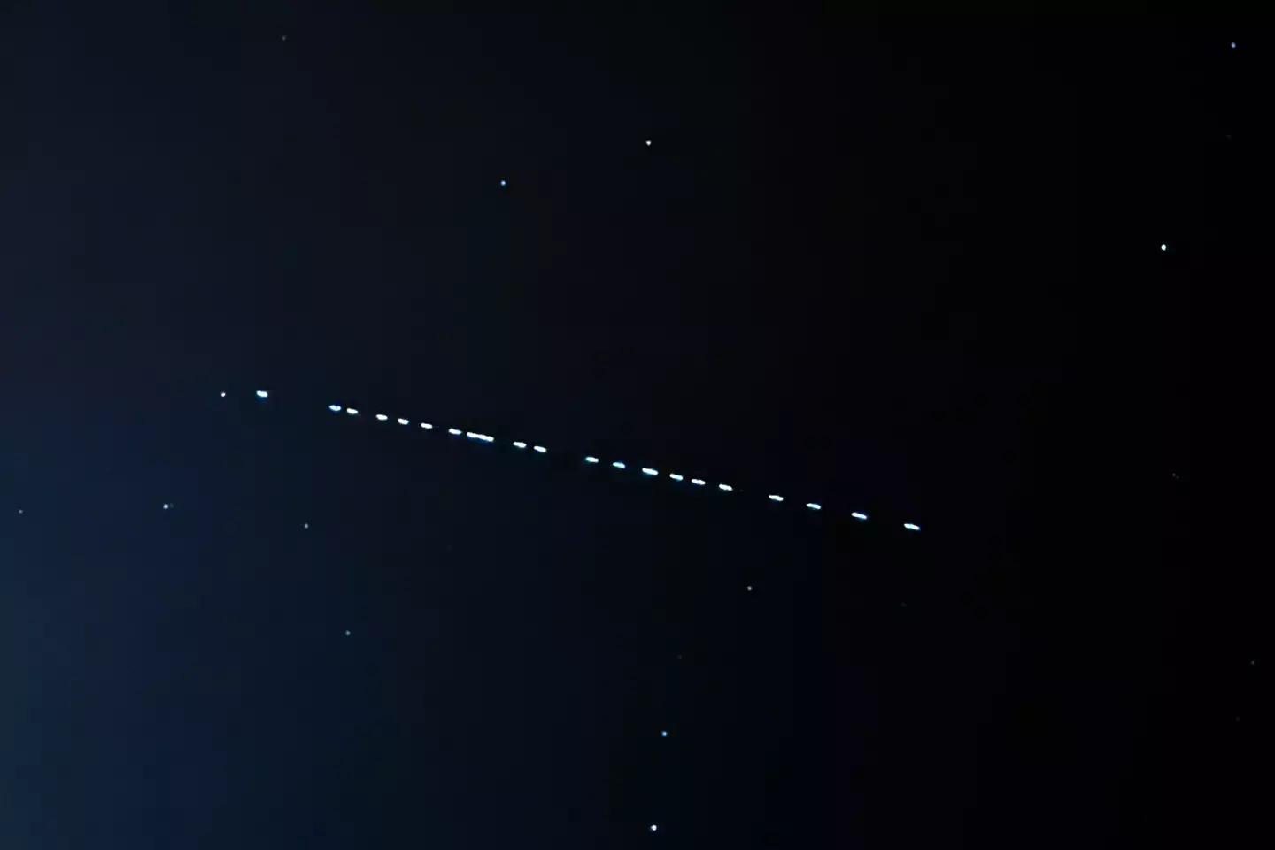 Starlink satellites passage spotted in the sky, similar to those people have mistaken for UFOs (Photo by Jakub Porzycki/NurPhoto via Getty Images)