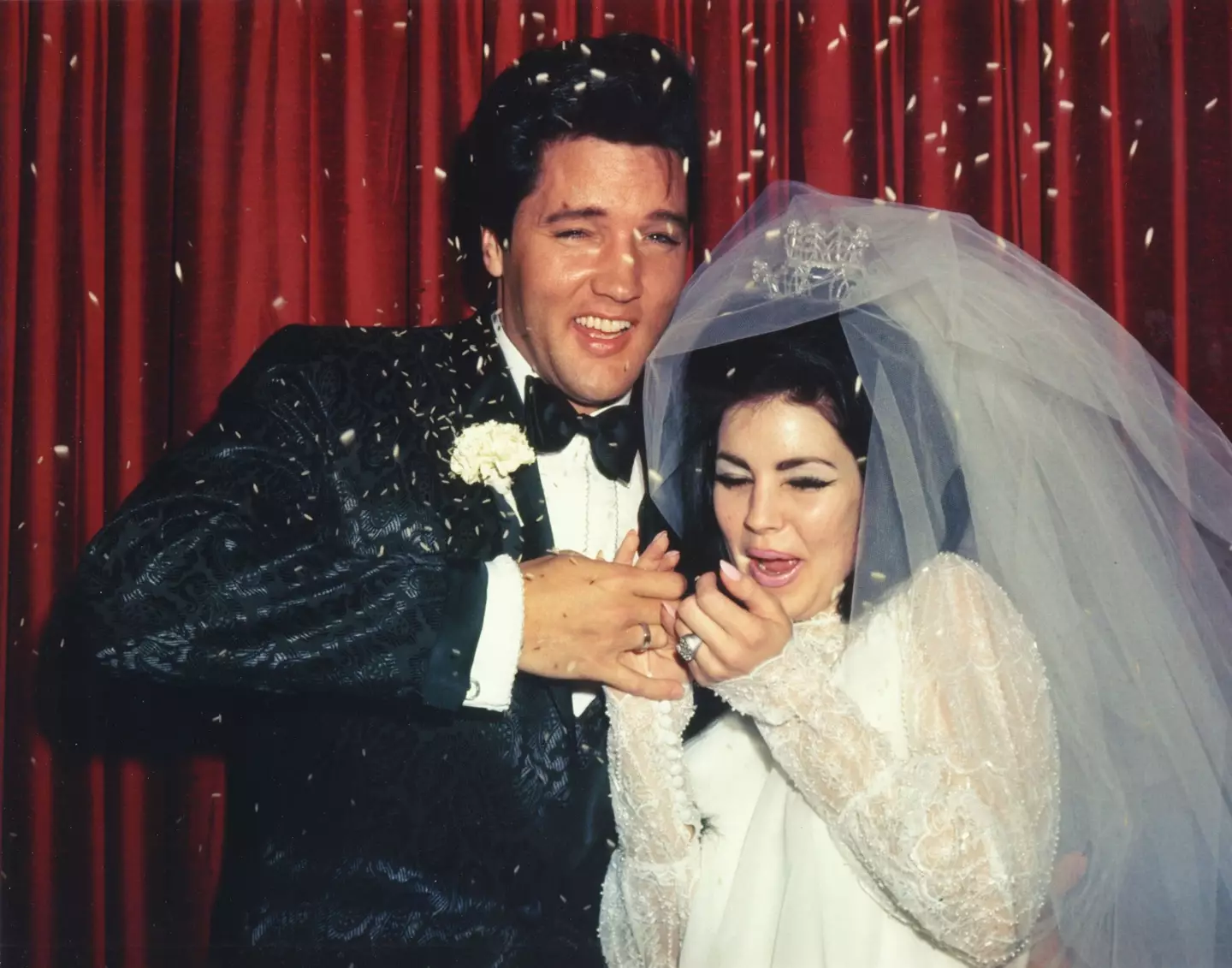 Elvis Presley & Priscilla Presley at their wedding in 1967.