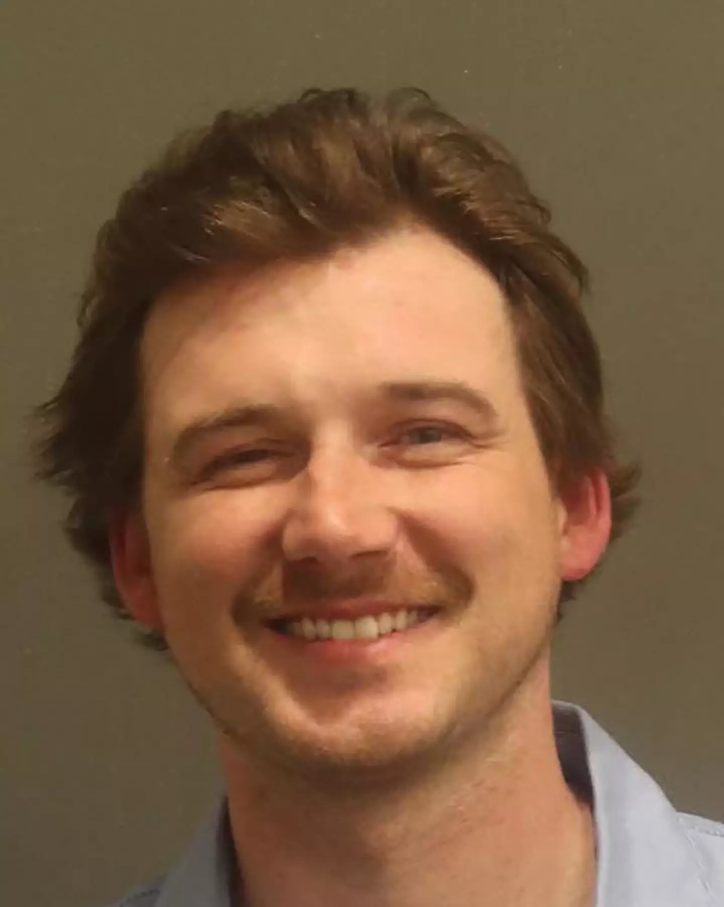 Morgan Wallen was shown smiling in his booking photo. (Metropolitan Nashville Police Department via Getty Images)