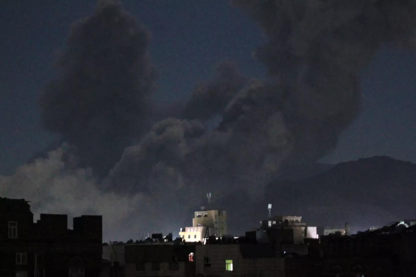 A plume of smoke billows during a US strike on Yemen's Huthi-held capital Sanaa (MOHAMMED HUWAIS/AFP via Getty Images)