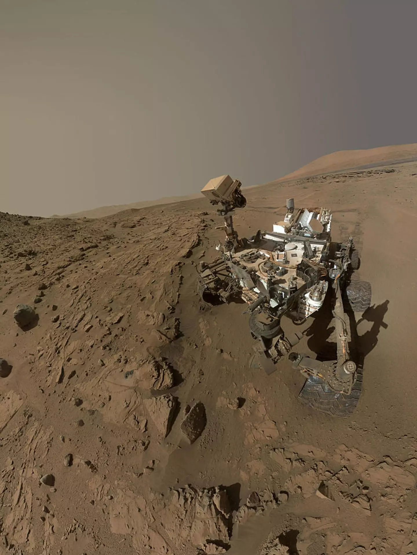 NASA's Curiosity Mars rover used the camera at the end of its arm in April and May 2014 to take dozens of component images combined into this self-portrait where the rover drilled into a sandstone target called 'Windjana' (NASA/JPL-Caltech/MSSS via Getty Images)