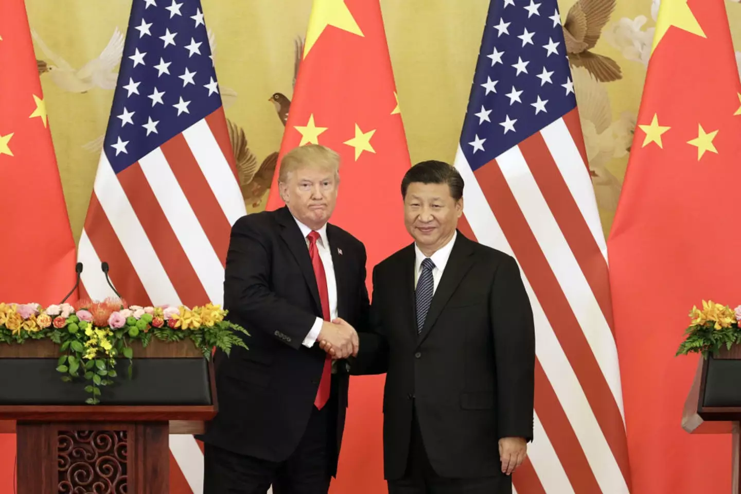 Trump and Jinping pictured shaking hands back in 2017, during Trump's first term (Qilai Shen/Bloomberg via Getty Images)