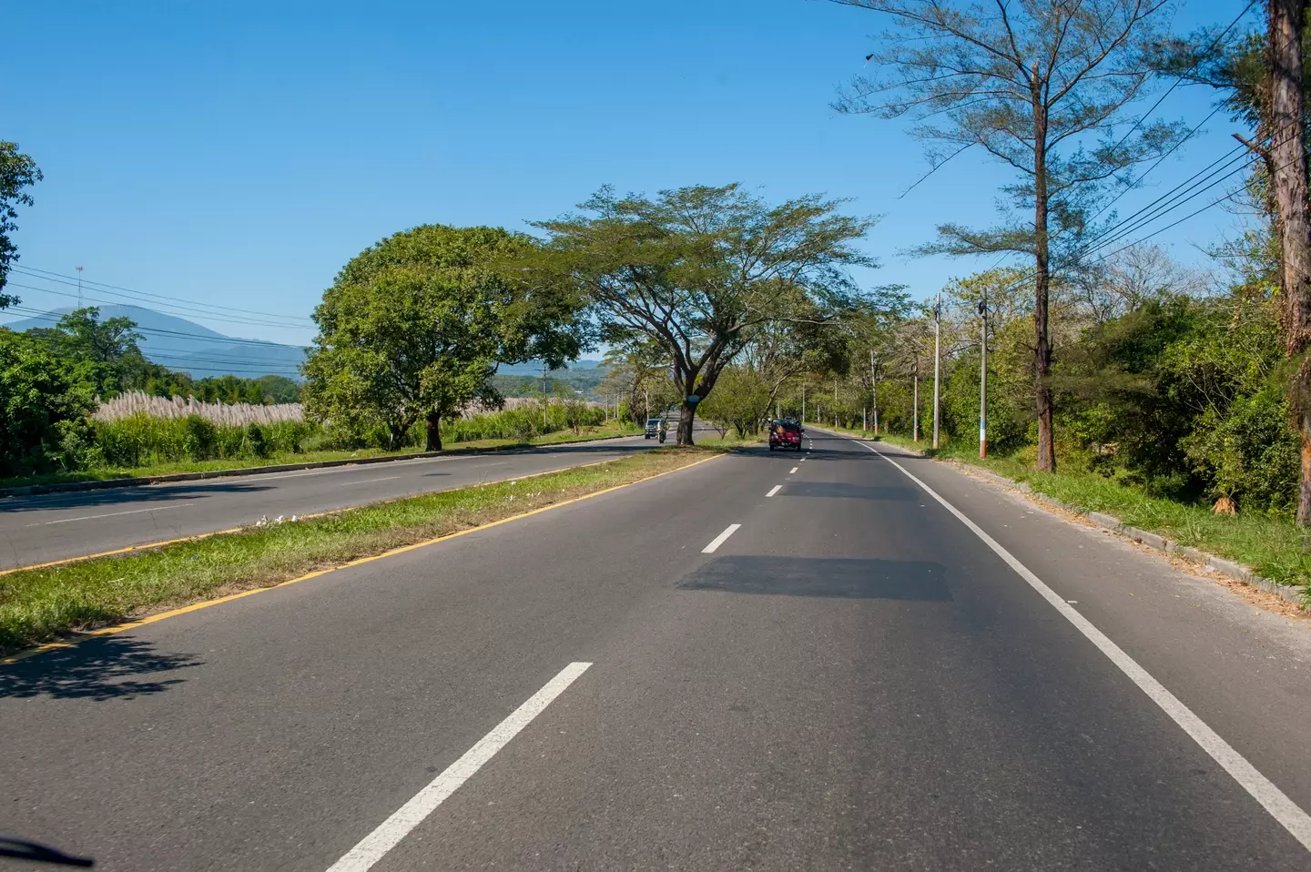 The road travels through a range of landscapes.