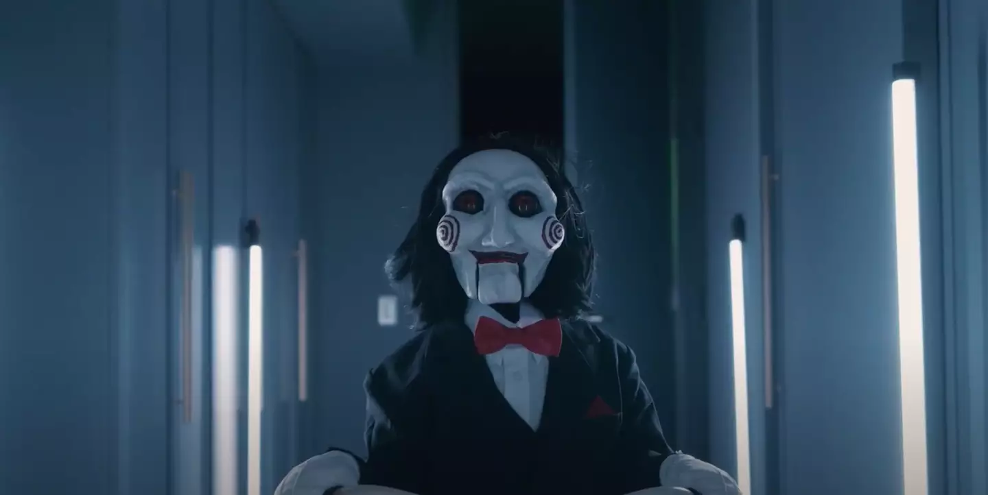 The parody sees Billy the puppet cycling into the cinema as Jigsaw himself narrates.