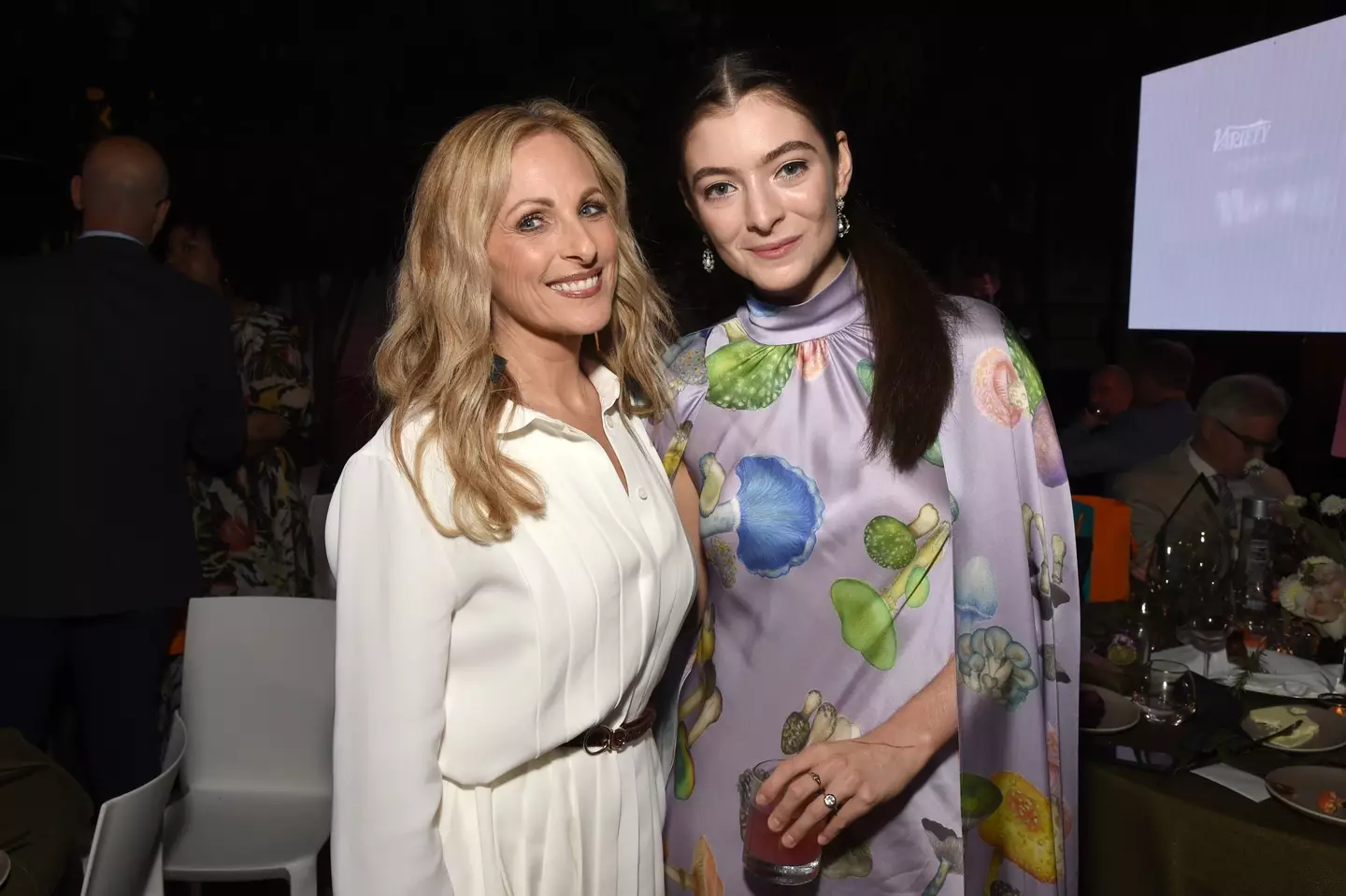 Lorde, pictured with Marlee Matlin, appeared to don an engagement ring at an event in 2021.