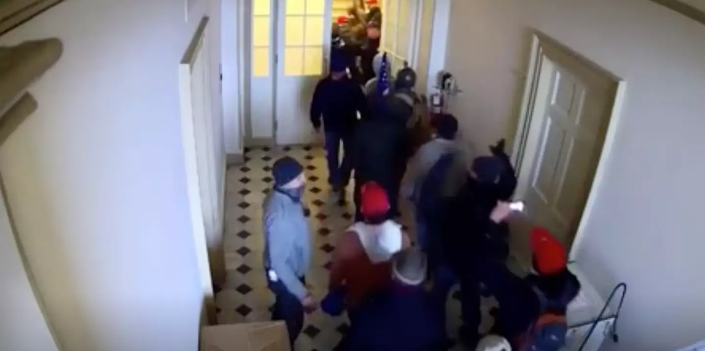 The moment the officers appeared to open the doors and wave in the protestors.