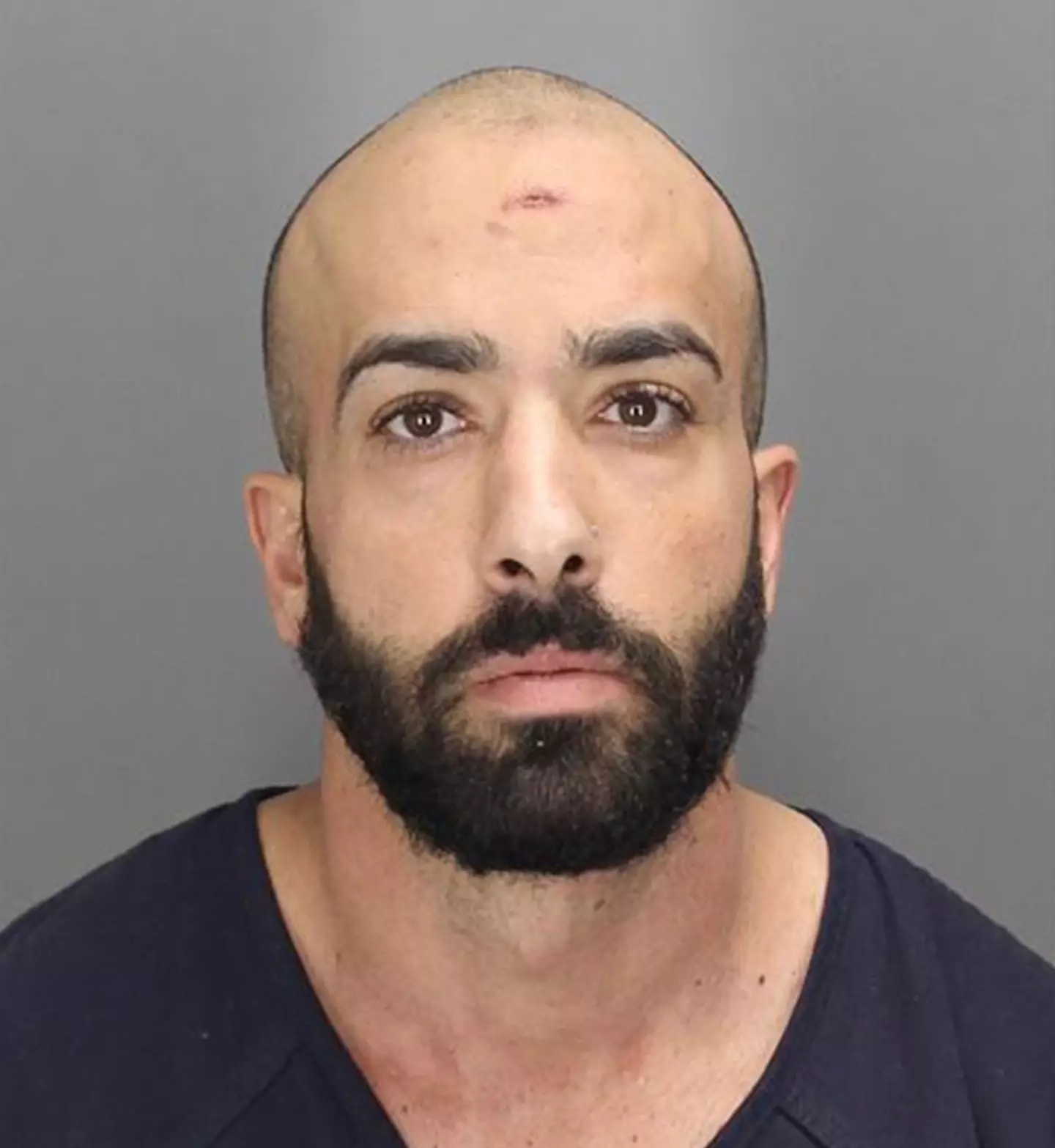 A man who was charged in an anti-semitic incident at a Jewish daycare has mooned a judge.