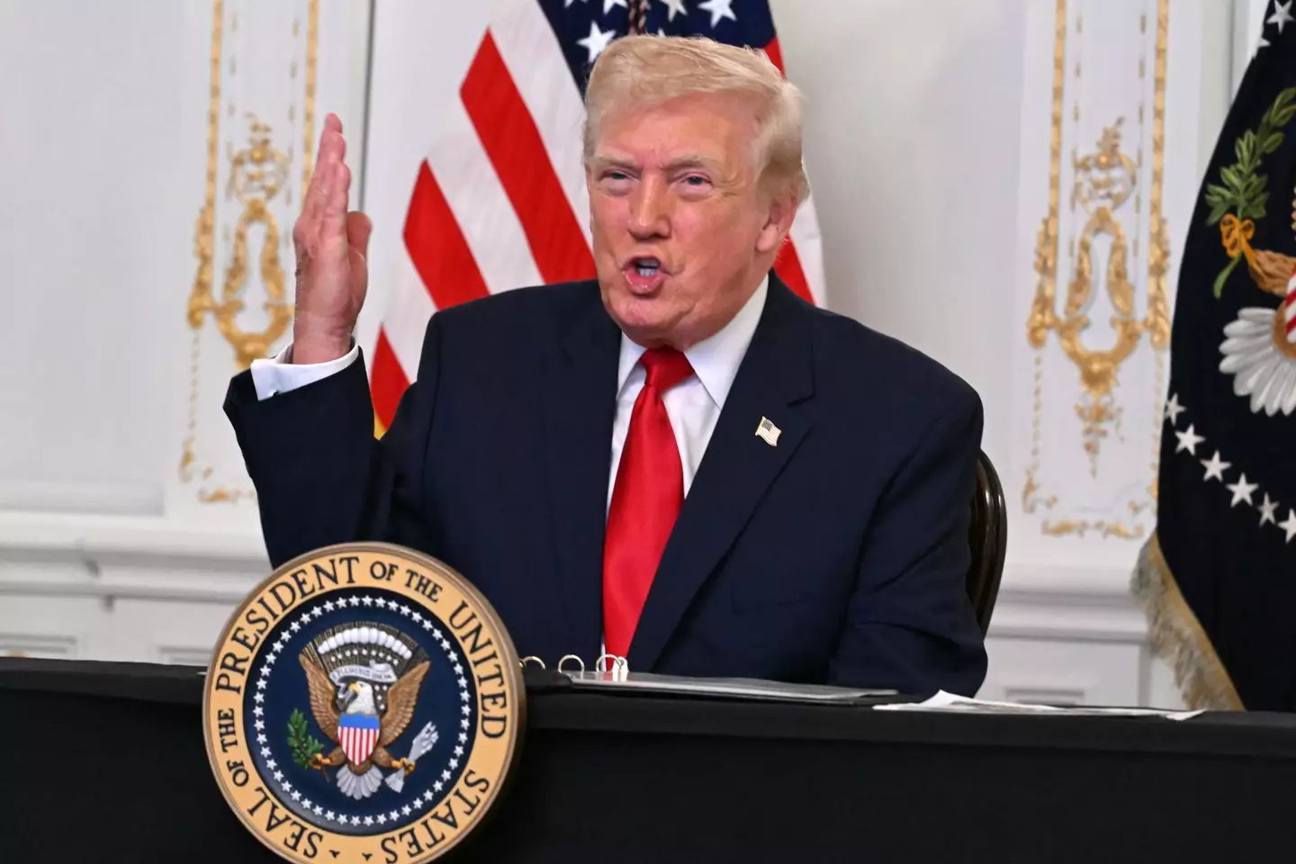 Donald Trump snapped at the reporter when asked why he was blaming Joe Biden's administration (Jim WATSON / AFP via Getty Images)
