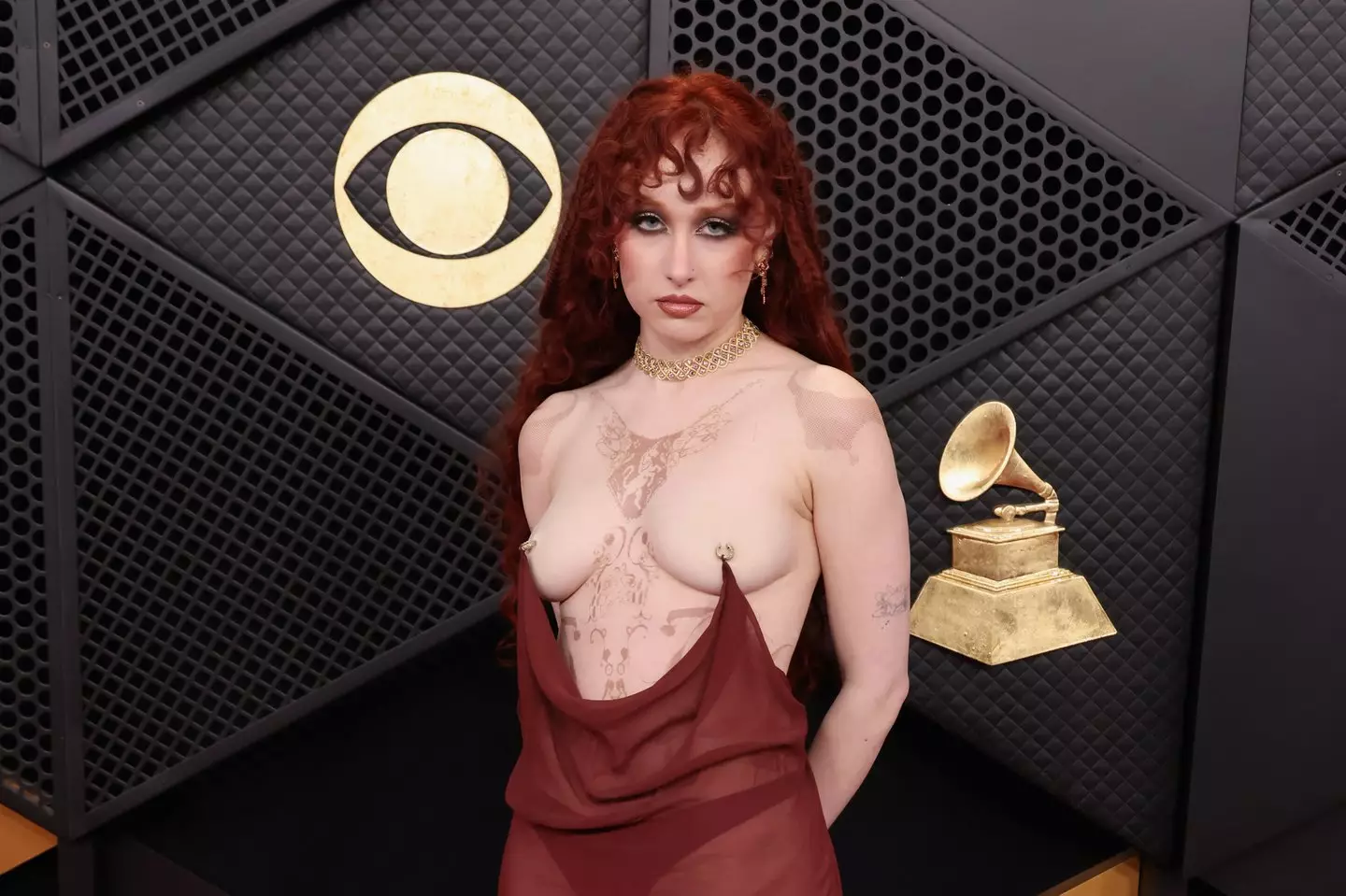 Roan's flowing red gown appeared to be held up by nipple piercings alone (John Shearer/Getty Images for The Recording Academy)