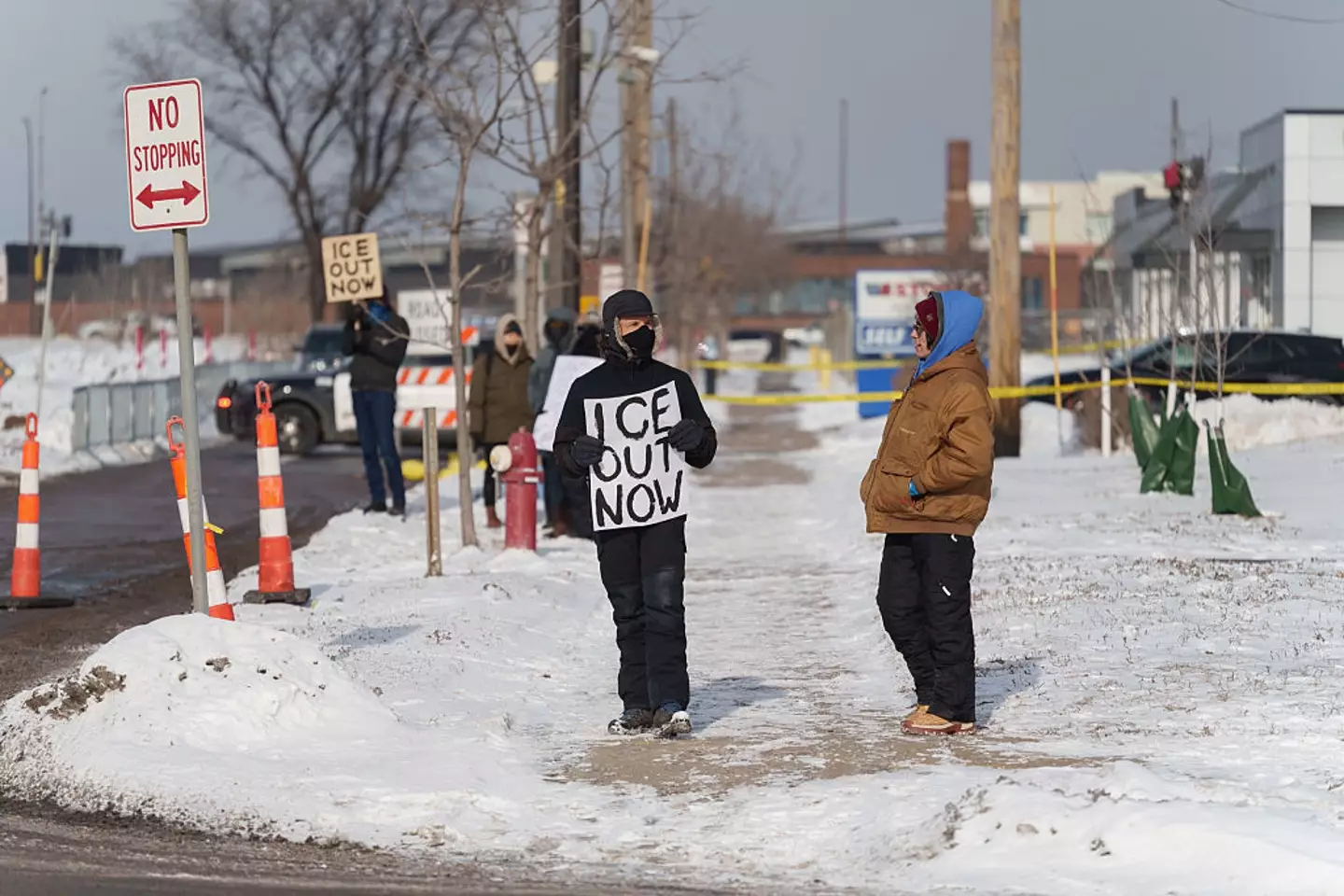 A protestor outside JD Vance's news conference in Minneapolis (Tim Evans/Bloomberg via Getty Images)