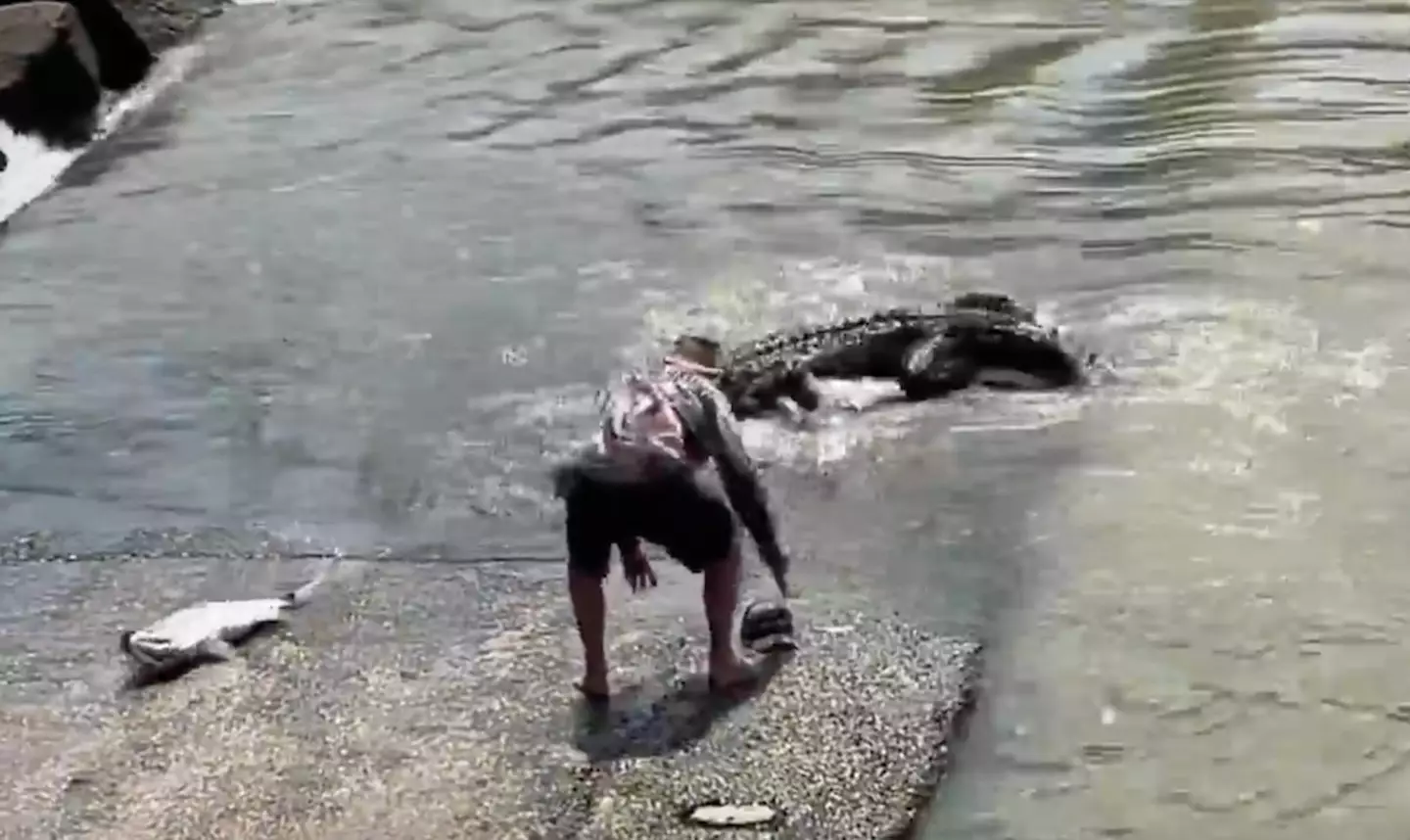 The fisherman's dad stepped in to save his son's hat.