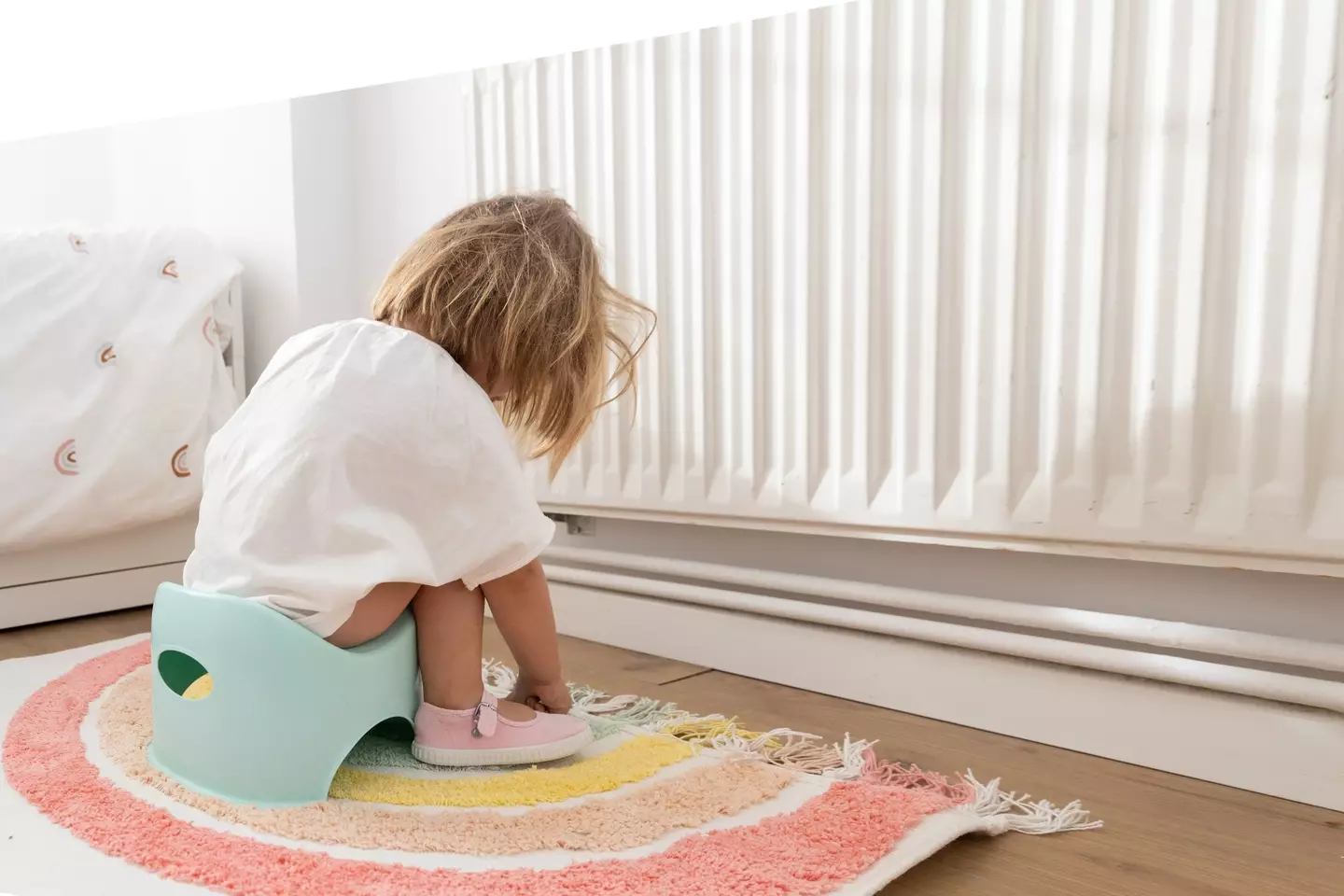 A toddler sitting on a potty (Getty Images)