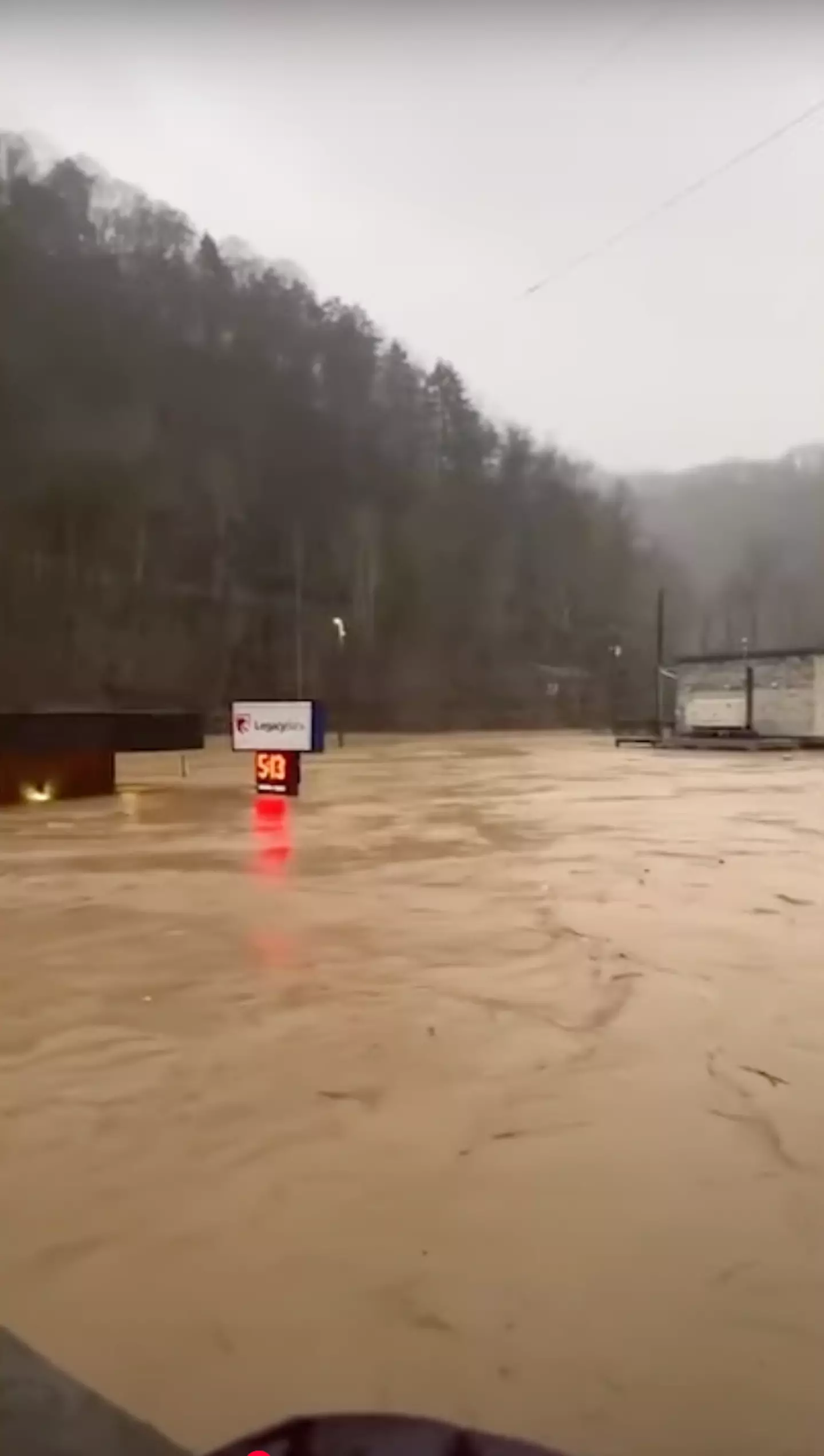The top of a tall sign can only just be seen in Virginia (Samantha Broughton/CBS News/YouTube)