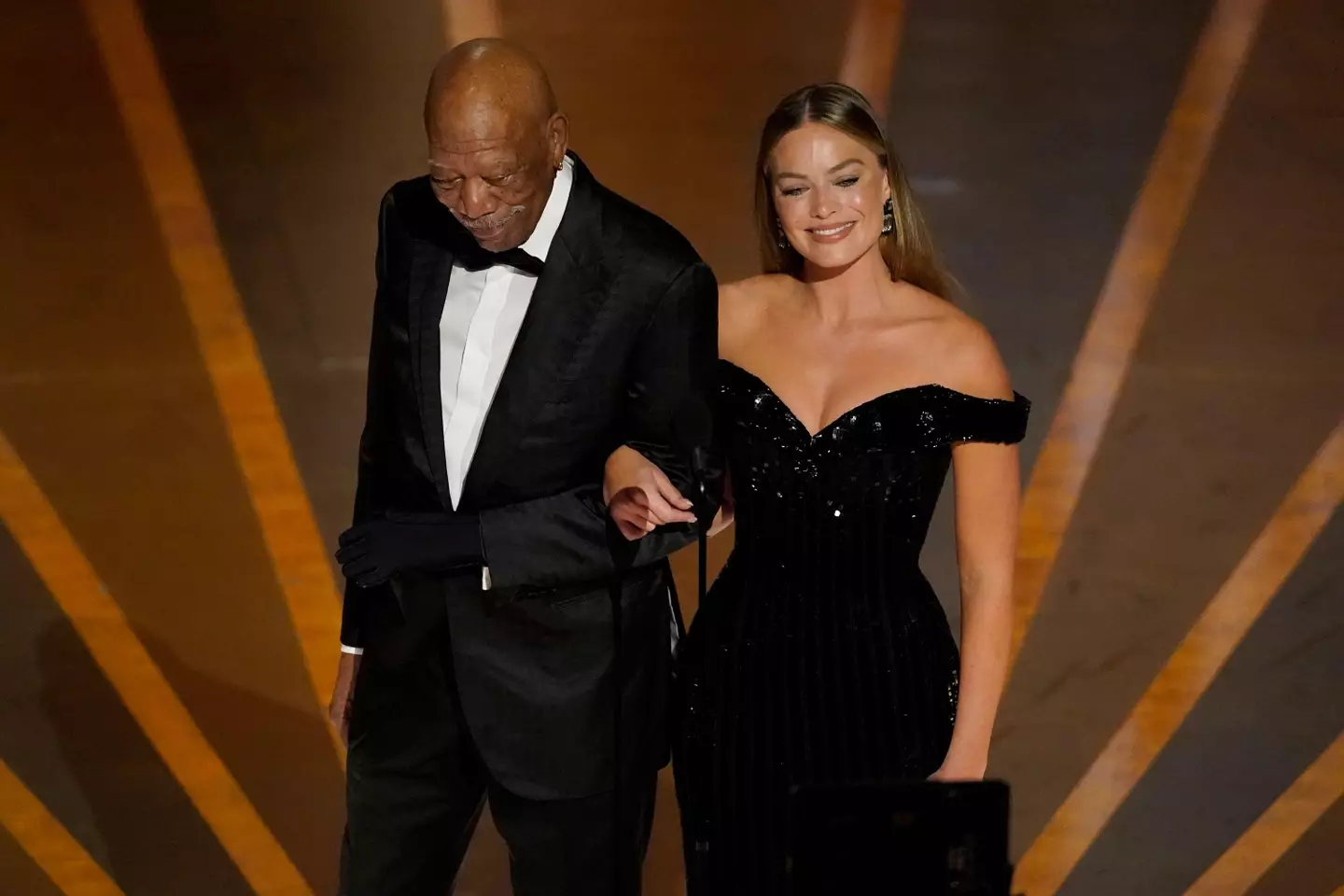 Morgan Freeman and Margot Robbie at the 2023 Oscars.