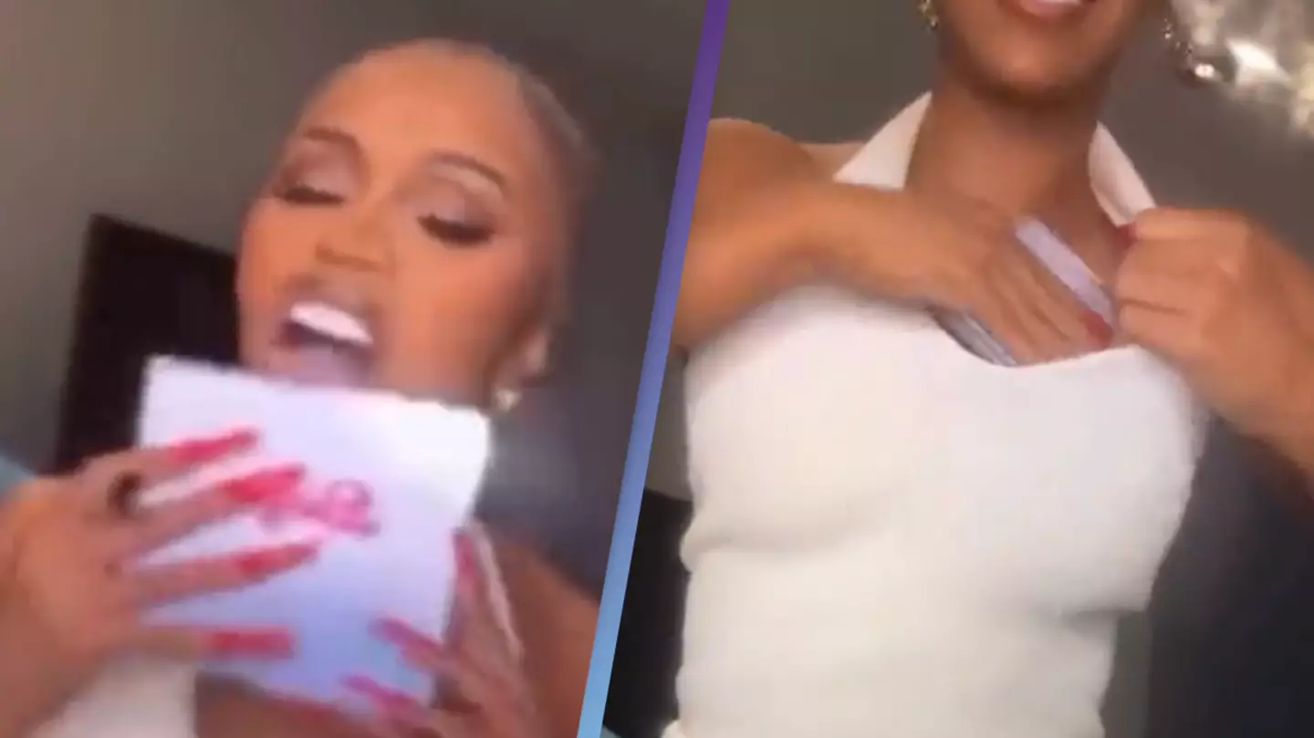 Cardi B licks and rubs autographed CDs all over her body in bizarre video