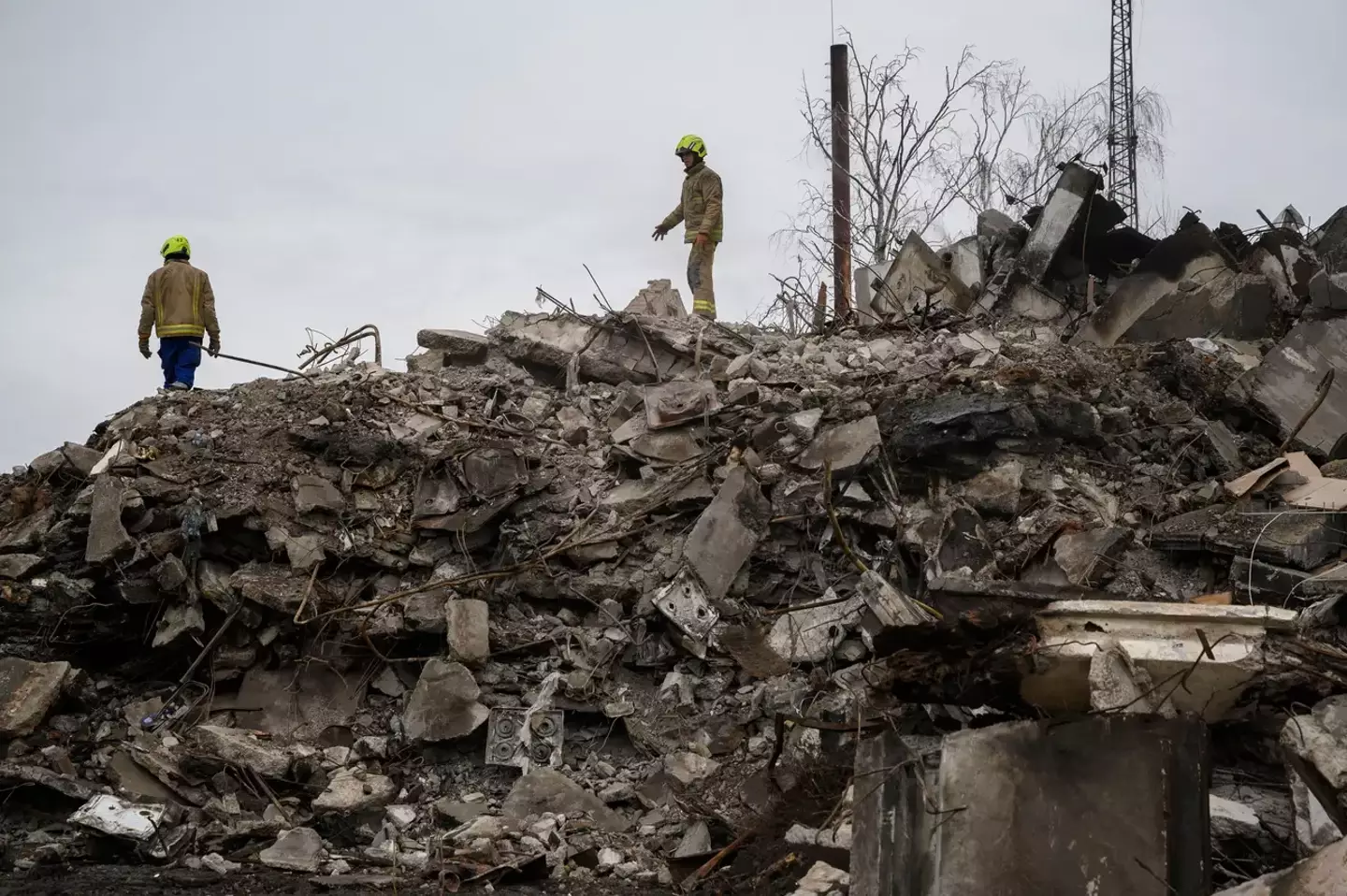 Workers on collapsed building in Ukraine.