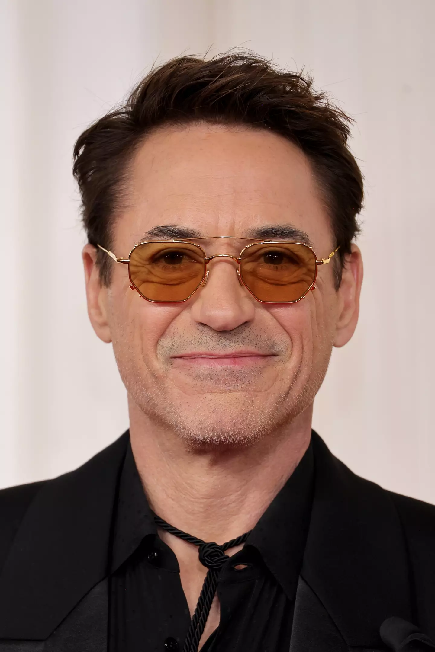 Robert Downey Jr. walks the red carpet at the Oscars.