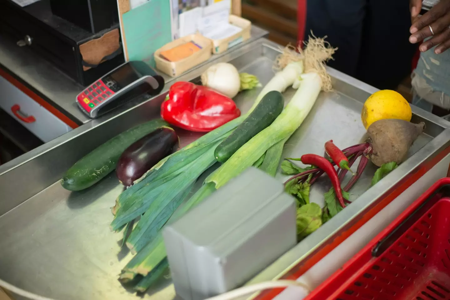 A woman has explained what happened when the person in front of her couldn't afford their grocery shopping.