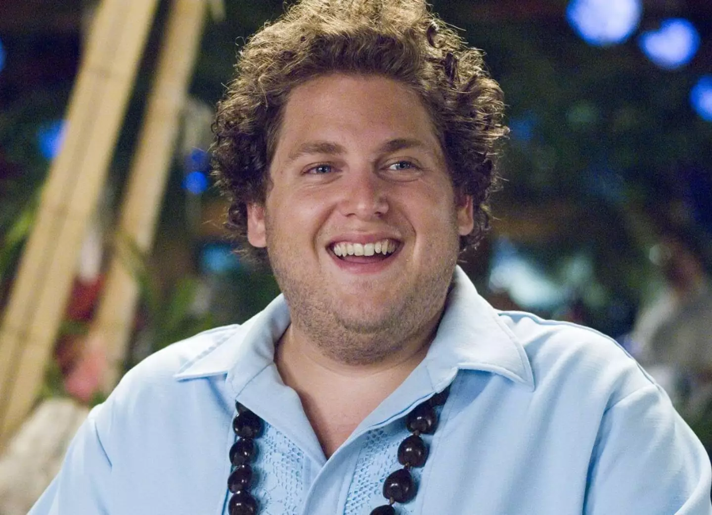 Hill plays a waiter at the resort.