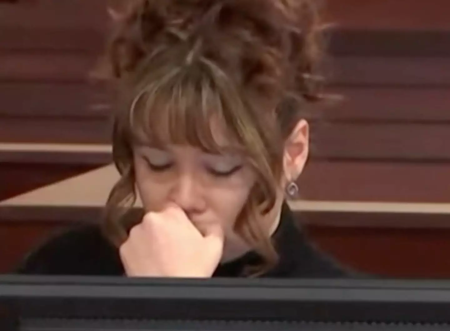 Gutierrez-Reed covered her face as the photos were presented.