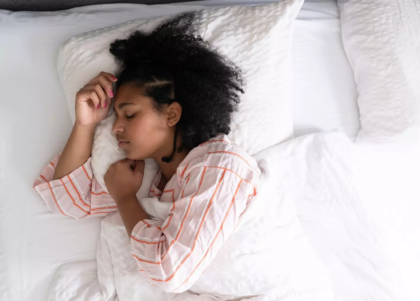 Sleeping on your side or back is the best way to get a good night's sleep (Getty Stock Image)