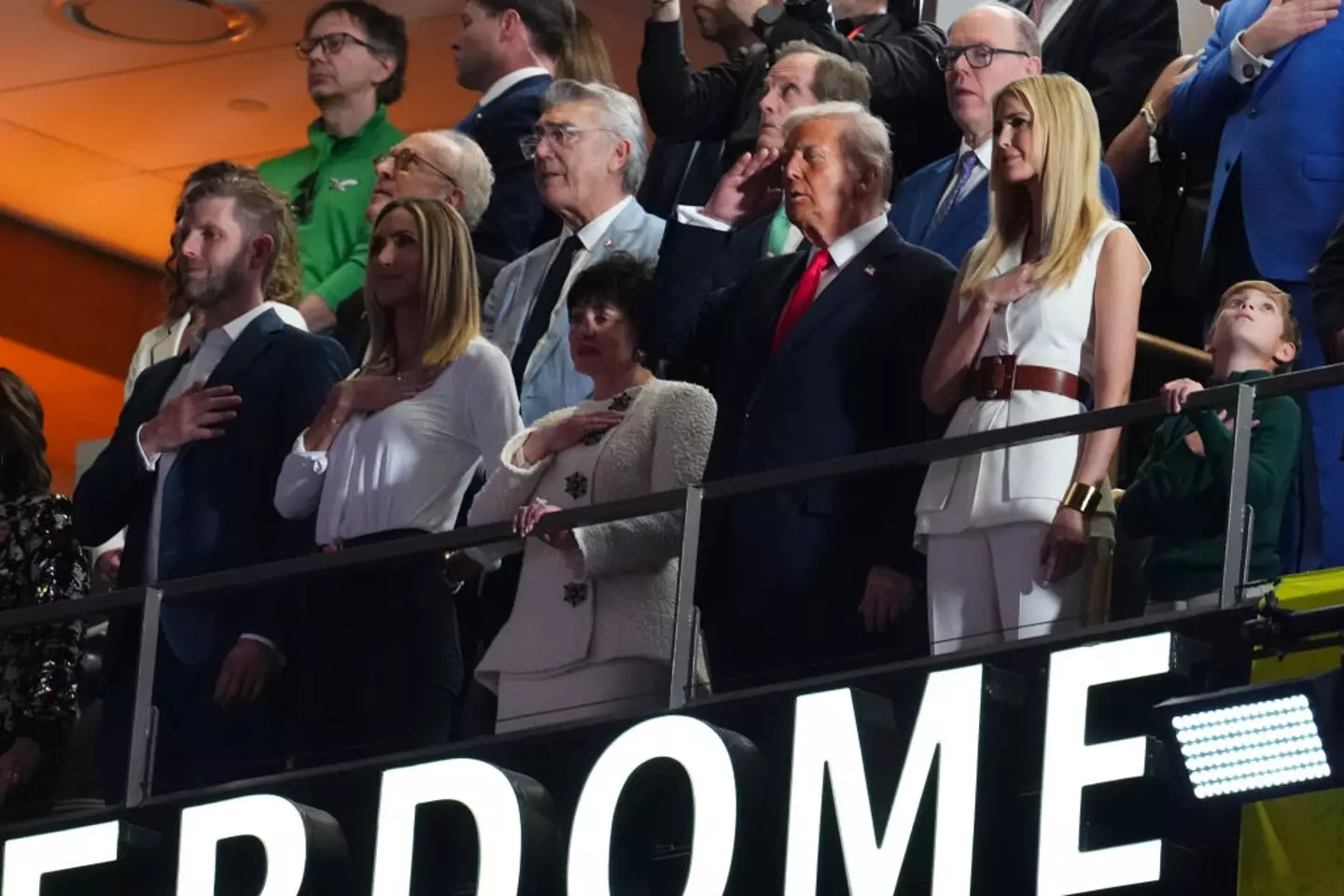 President Donald Trump saluted during the national anthem (Cooper Neill/Getty Images)