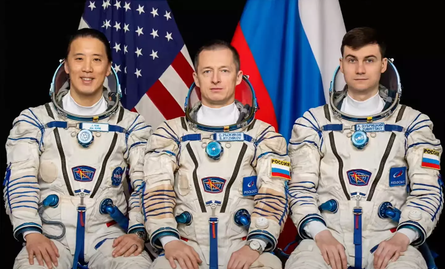 NASA astronaut Johnny Kim, Russian cosmonaut Sergey Ryzhikov, and Alexey Zubritsky
