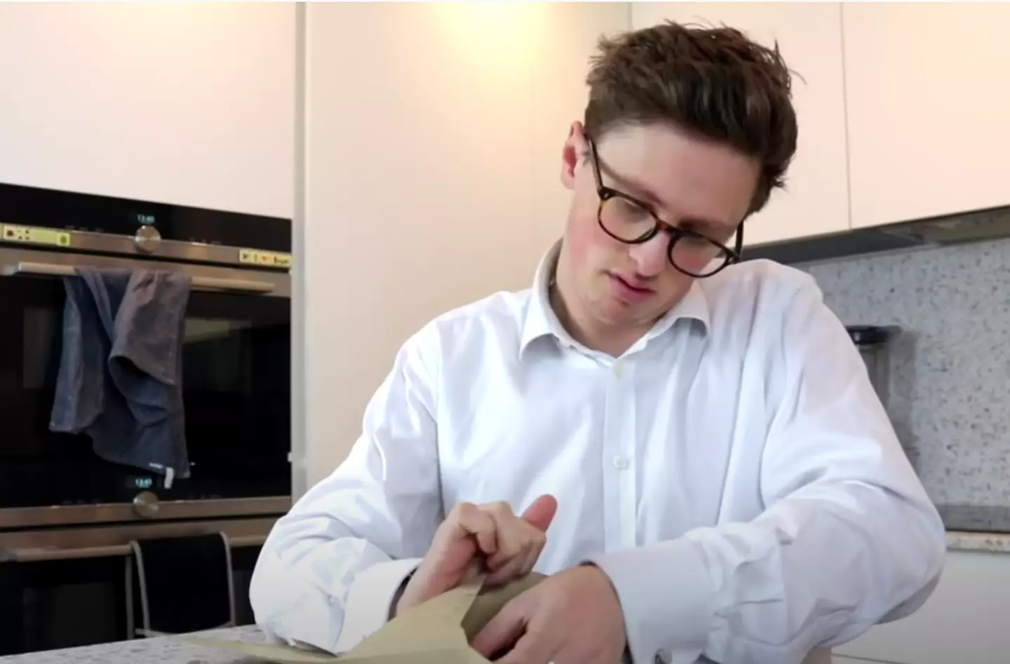 Fosh receiving documentation for his company, Unlimited Money Limited.