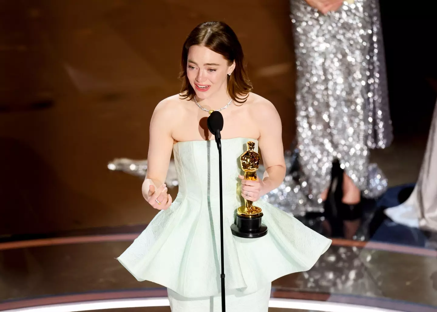 The back of Emma Stone's dress was 'broken' when she got up on stage.