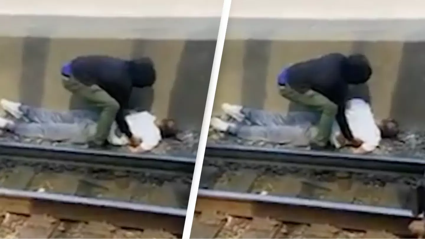Hero pulled man off train tracks while he was electrocuted in incredible footage