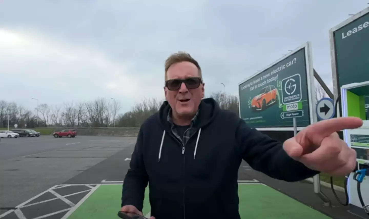 Lee attempting to charge the EV (YouTube/TheMacMaster)