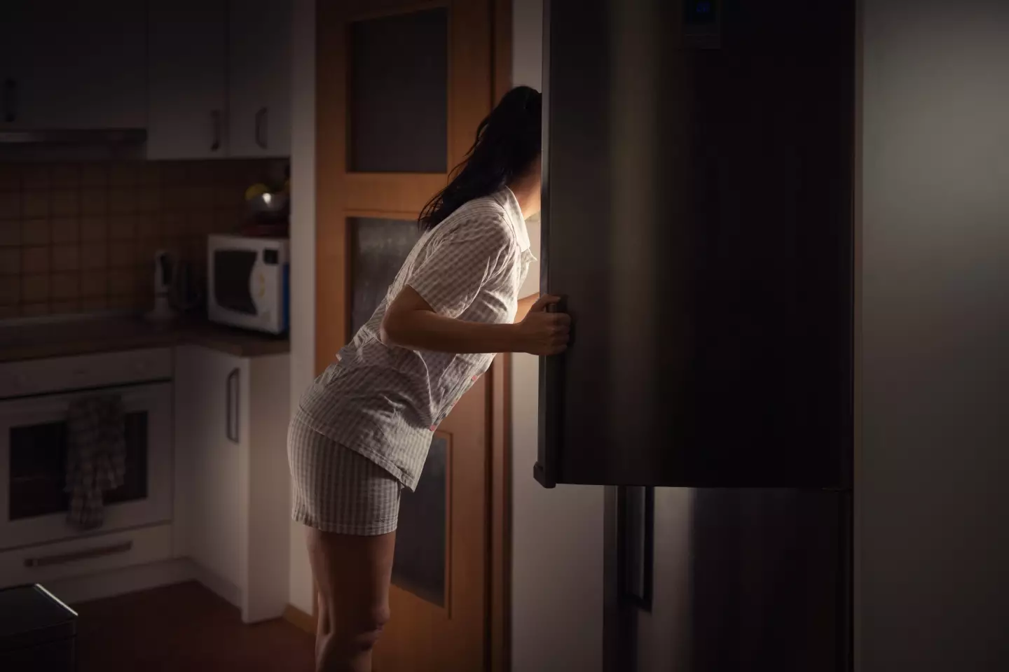Raiding the fridge will only make it harder to get to sleep (Getty Stock Images)