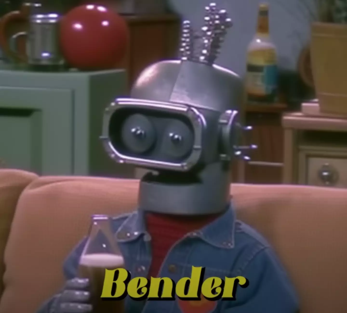 Bender sports a bedazzled denim jacket.