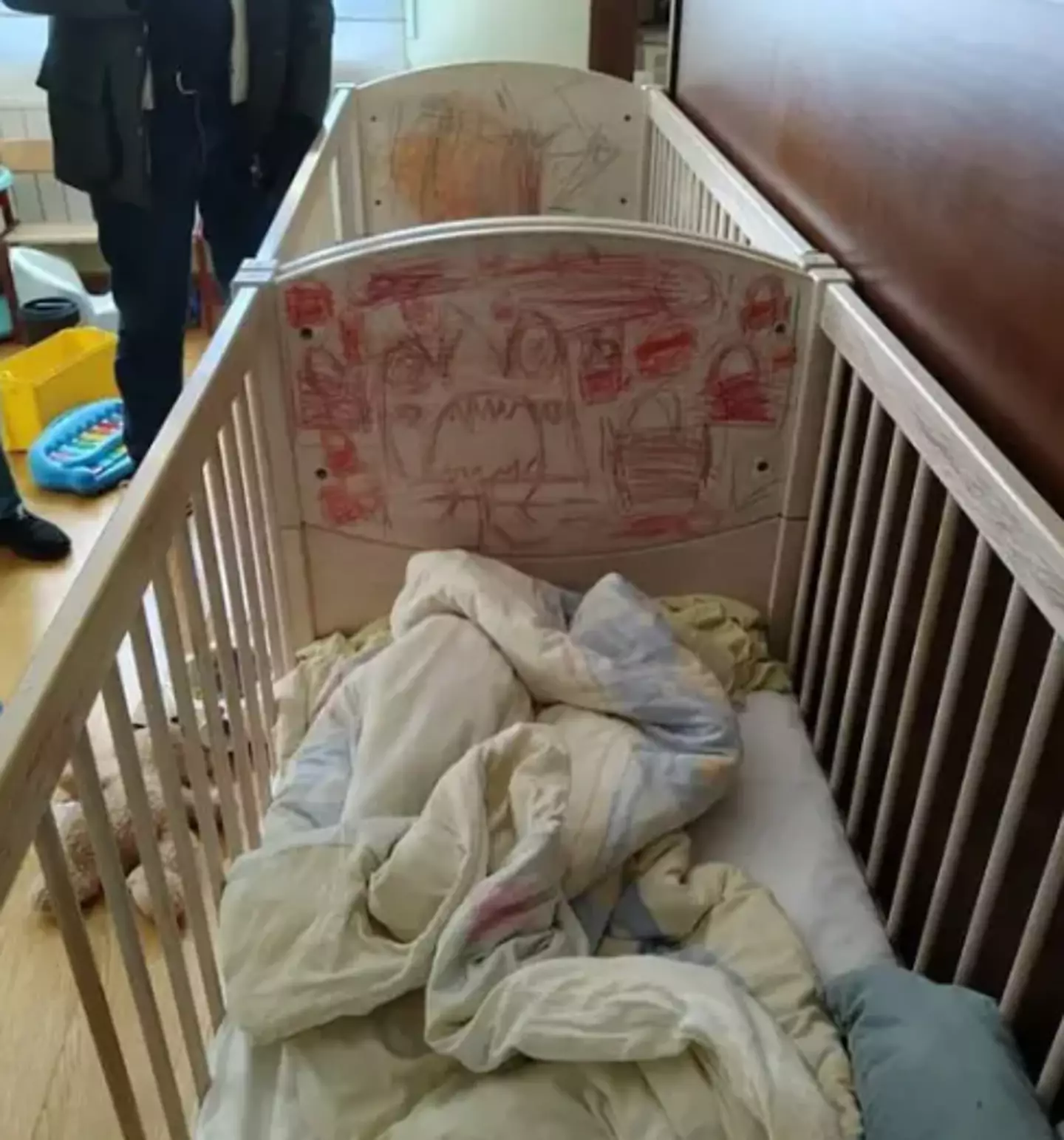 The children slept in cribs and wore masks (police handout)