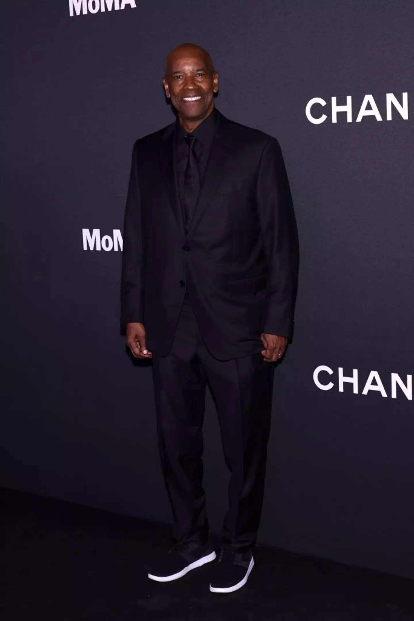 The 69-year-old was able to put the row with the autograph hunters behind him as he smiled for pictures on the red carpet (Arturo Holmes/Getty Images)