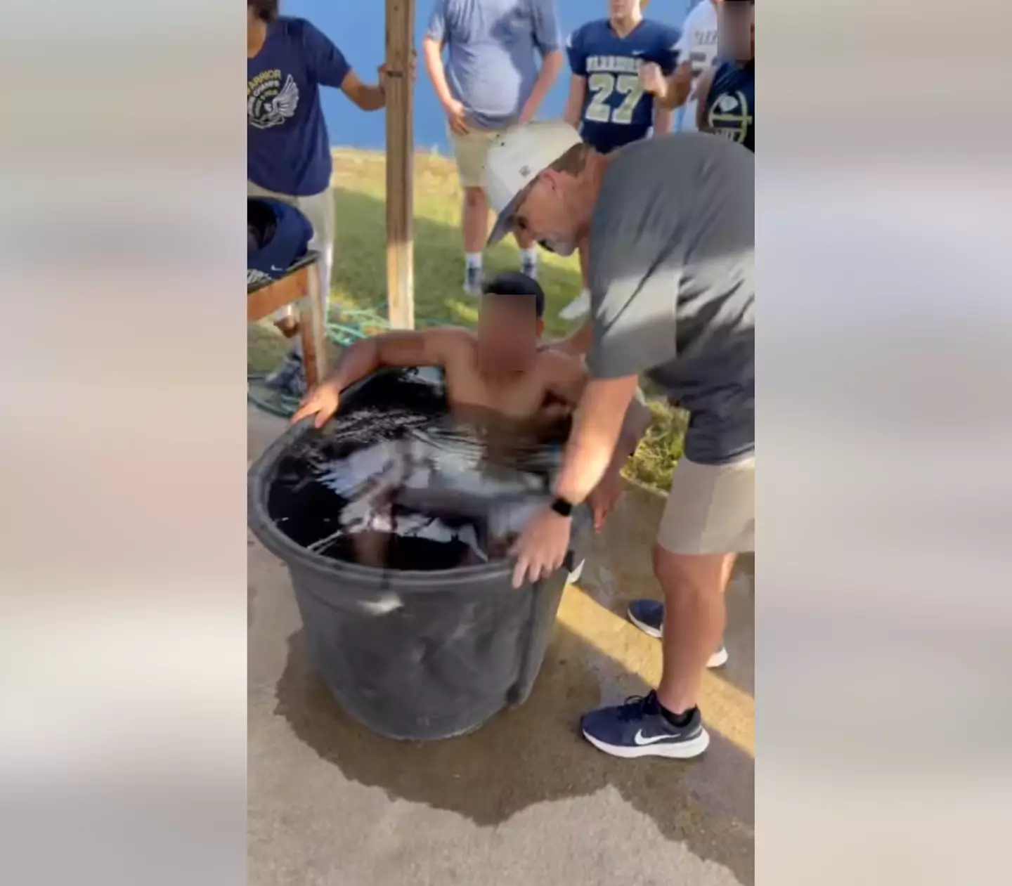 Students were baptized after a game.