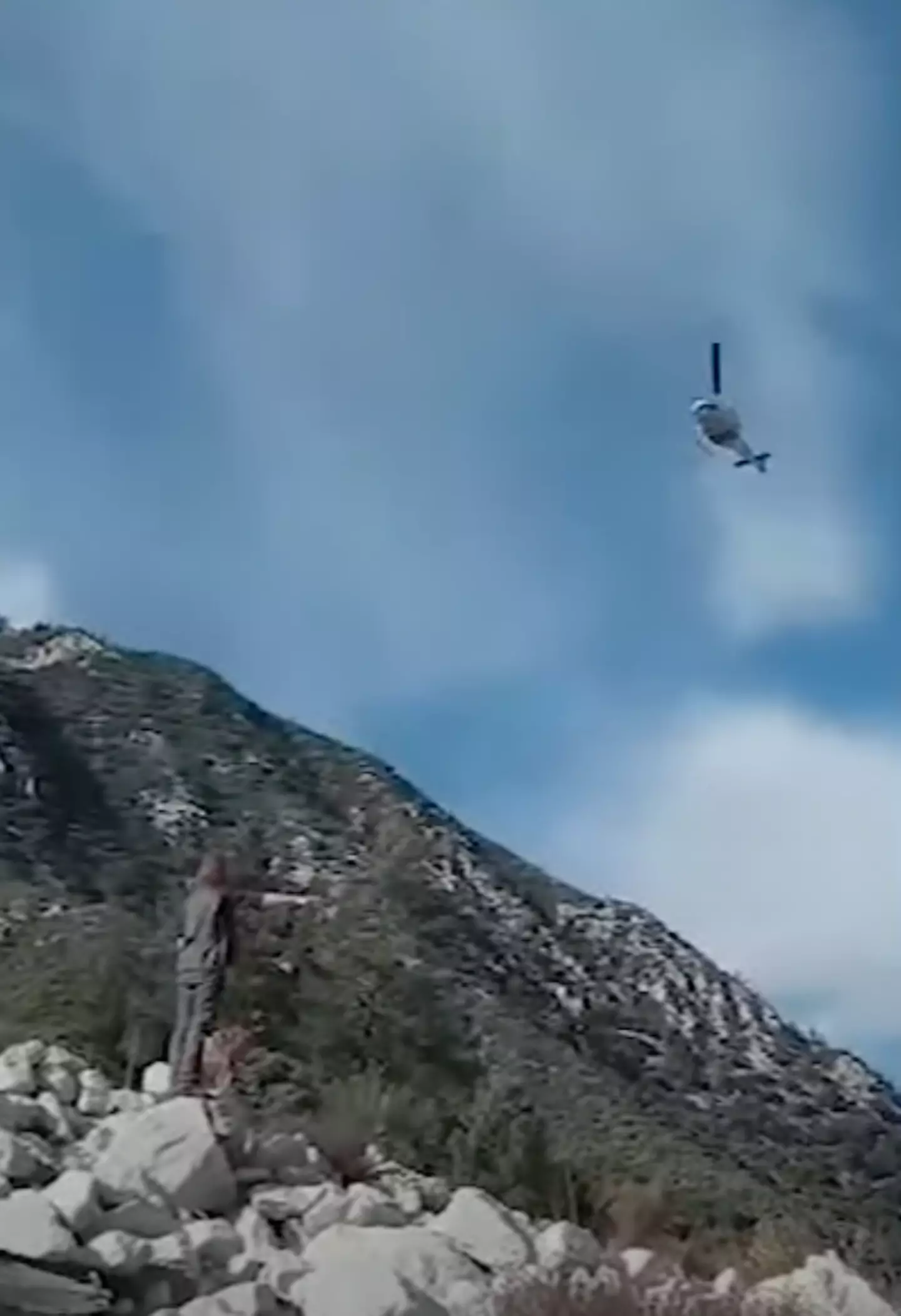 After the couple called 911, a helicopter came to rescue the stranded hiker.