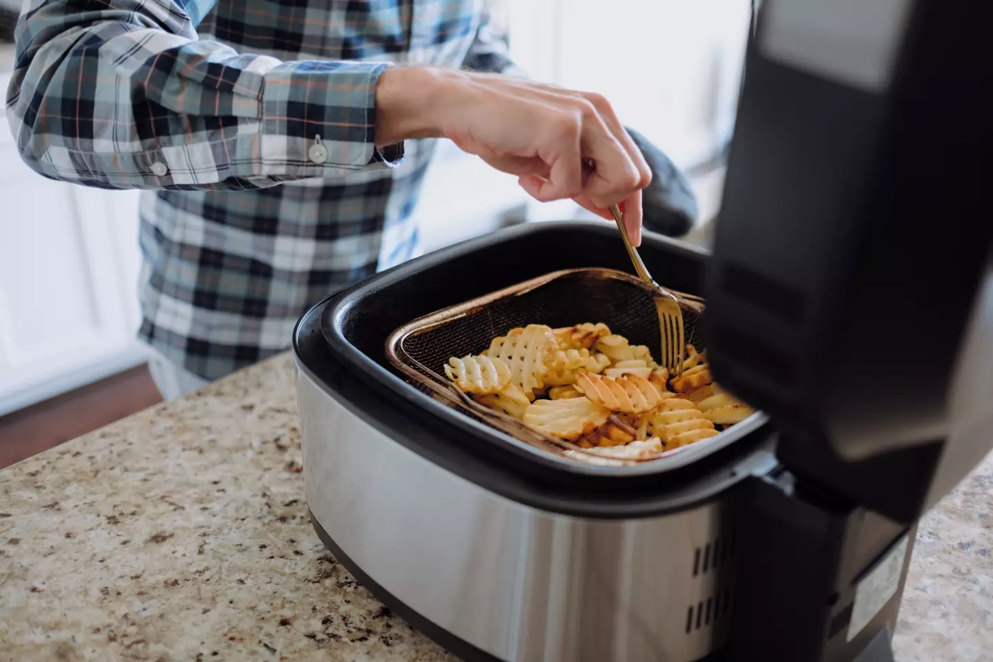Air fryers are used for cooking, not conversations (Getty Stock Photo)